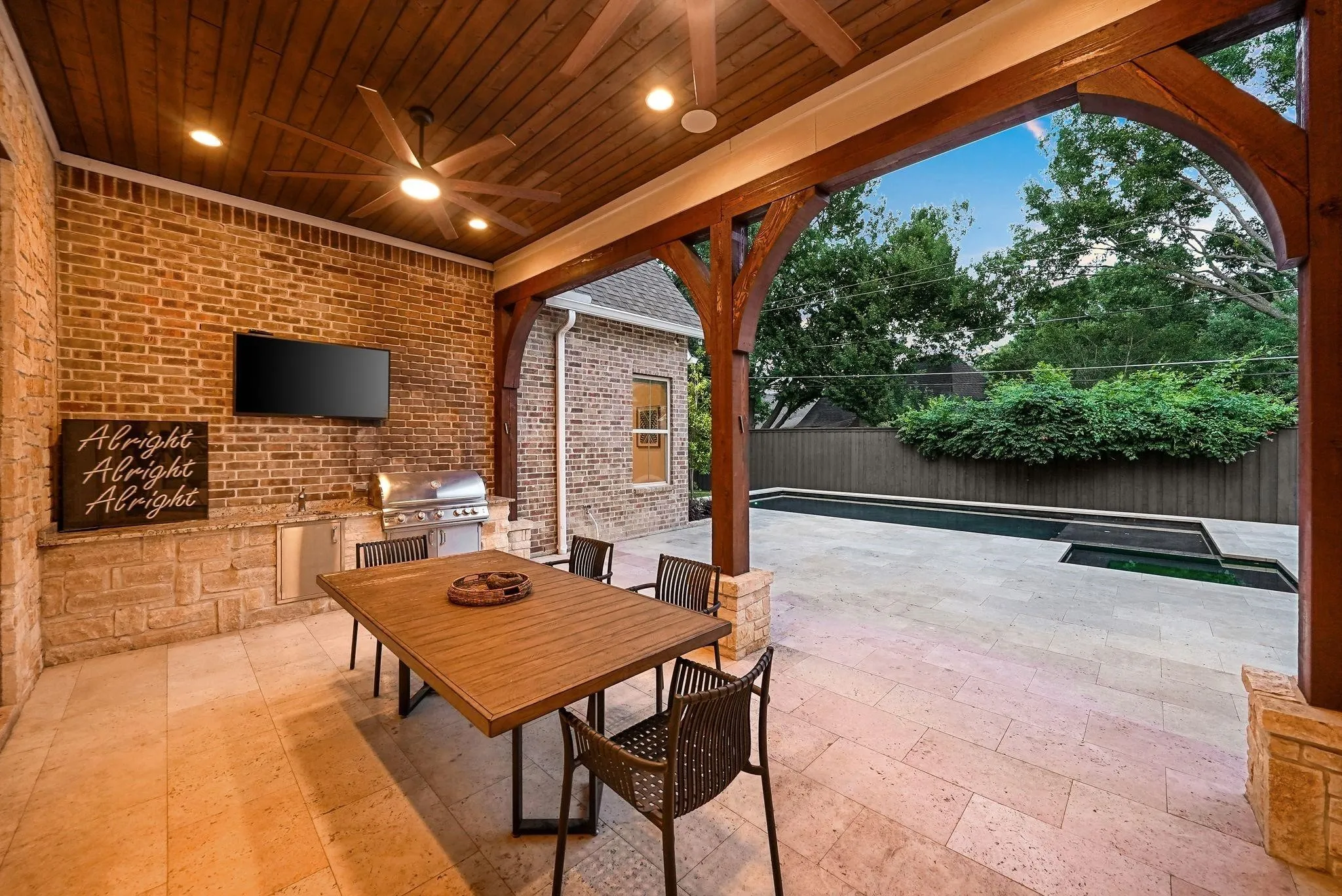 Covered patio featuring a wood-finish ceiling with recessed lighting and a ceiling fan