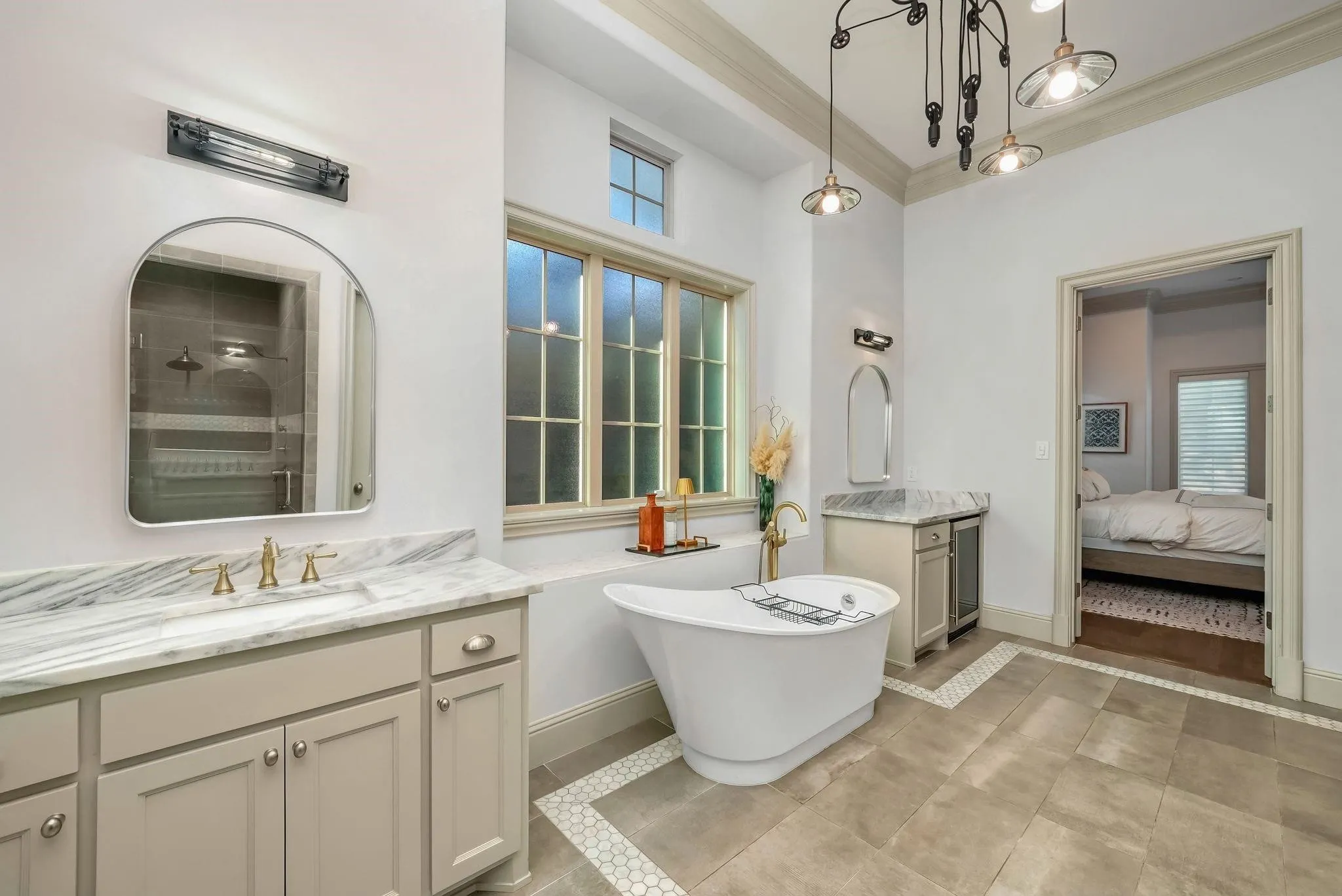 Freestanding soaking tub with gold-finish fixtures