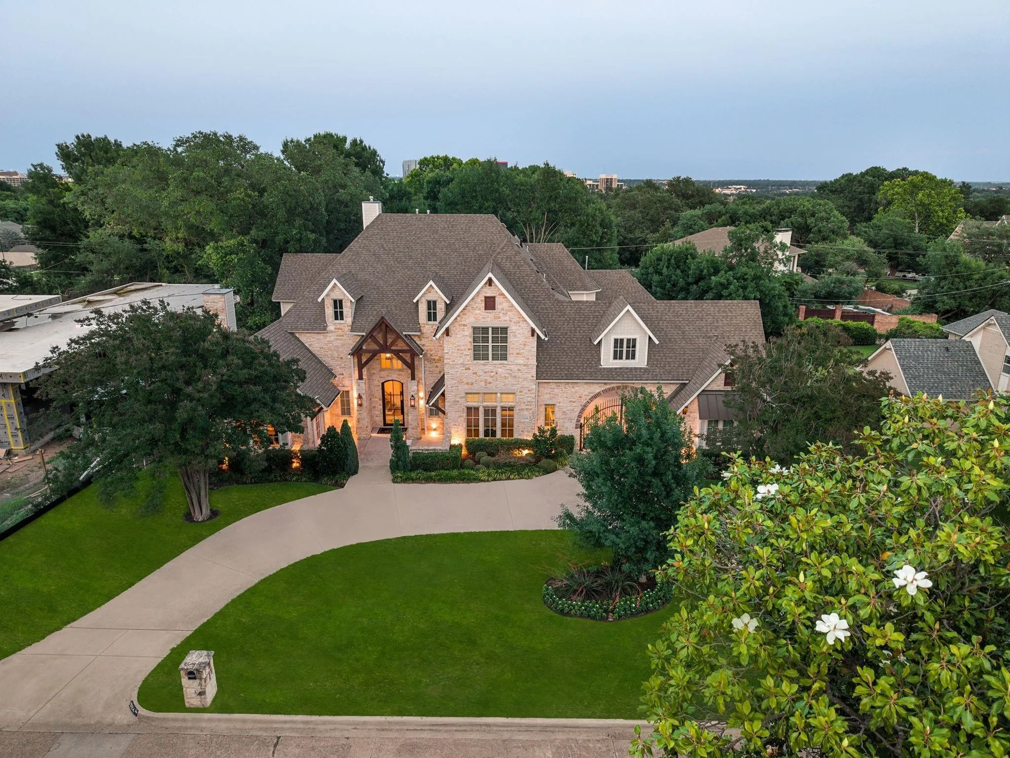 Stately brick and stone exterior with multiple gables and dormer windows