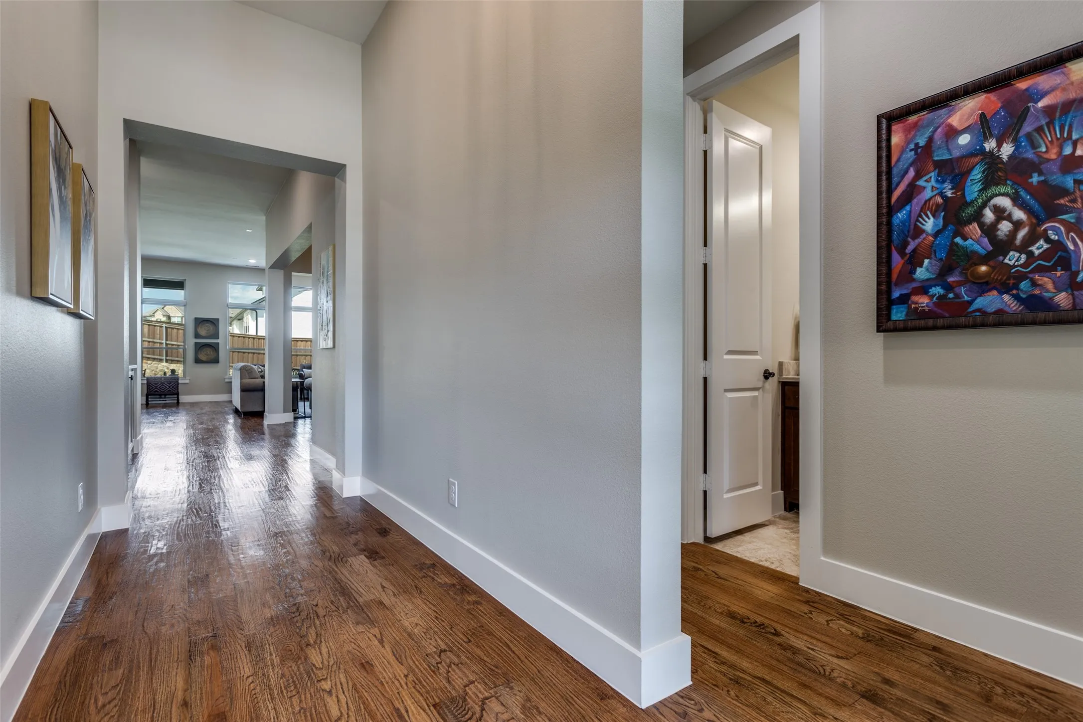 Gleaming real handscraped hardwood floors through the heart of the home