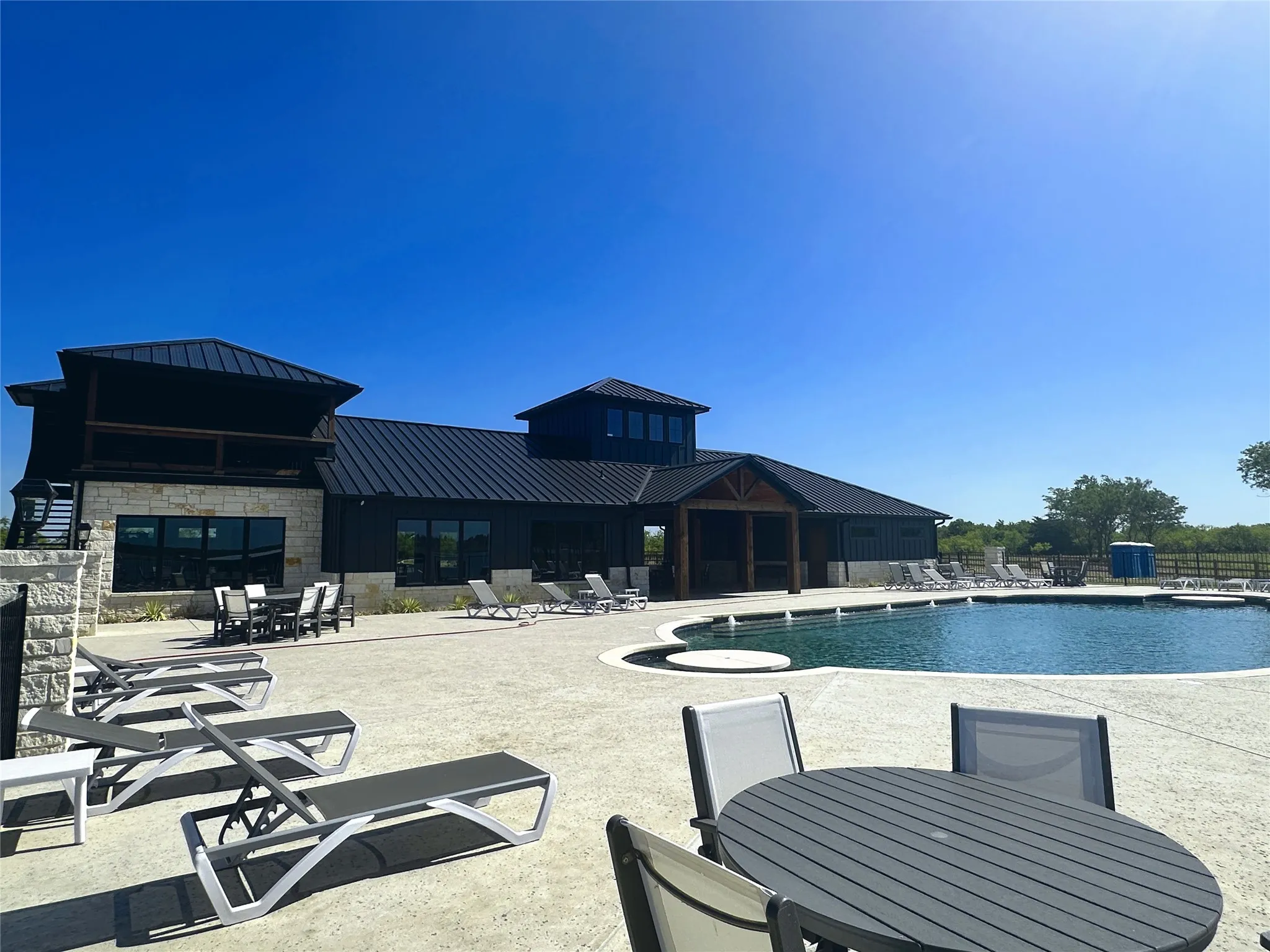 Clubhouse and pool complex create a resort-inspired gathering destination.