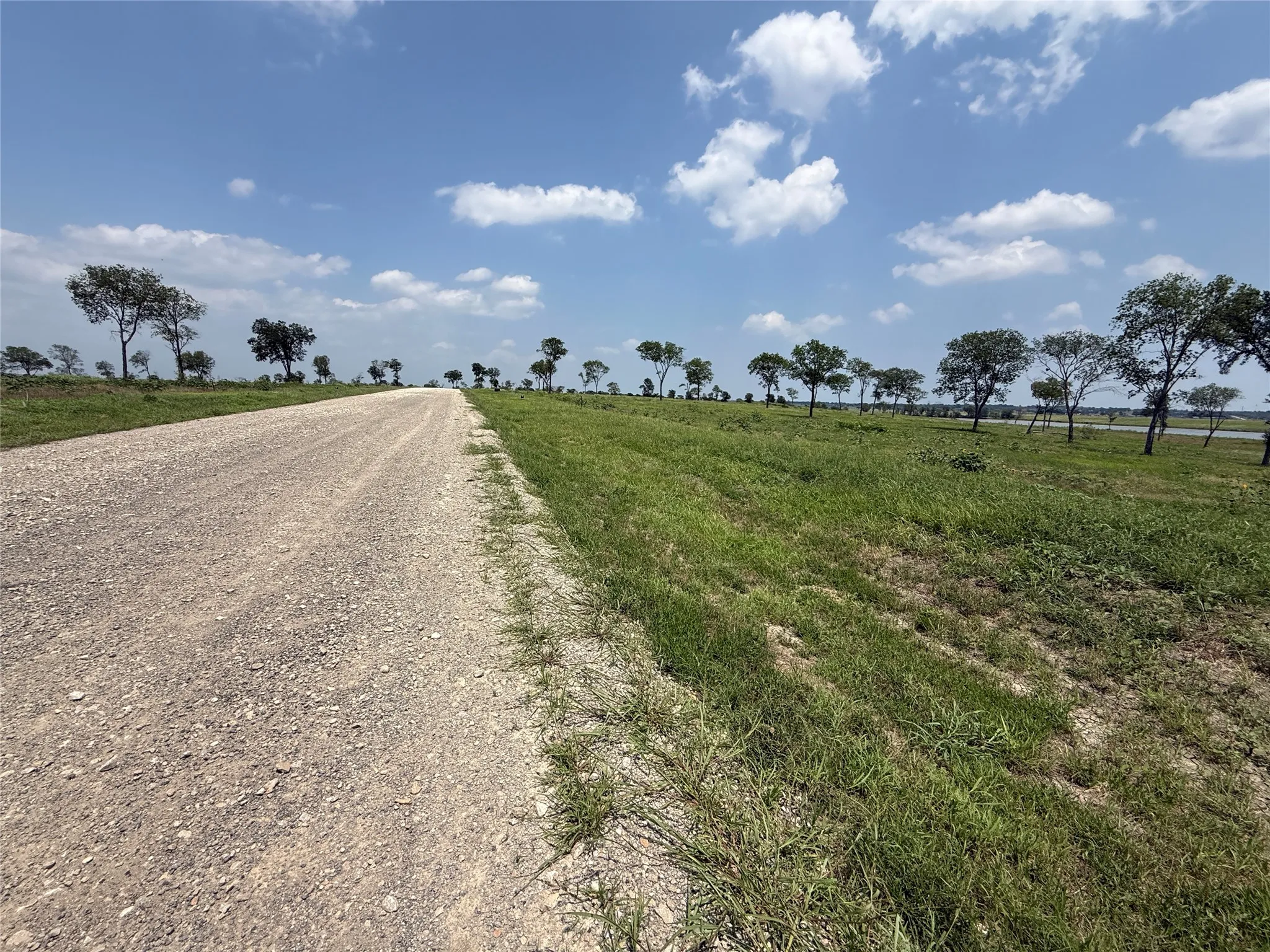 Private asphalt road providing convenient access to the homesite.