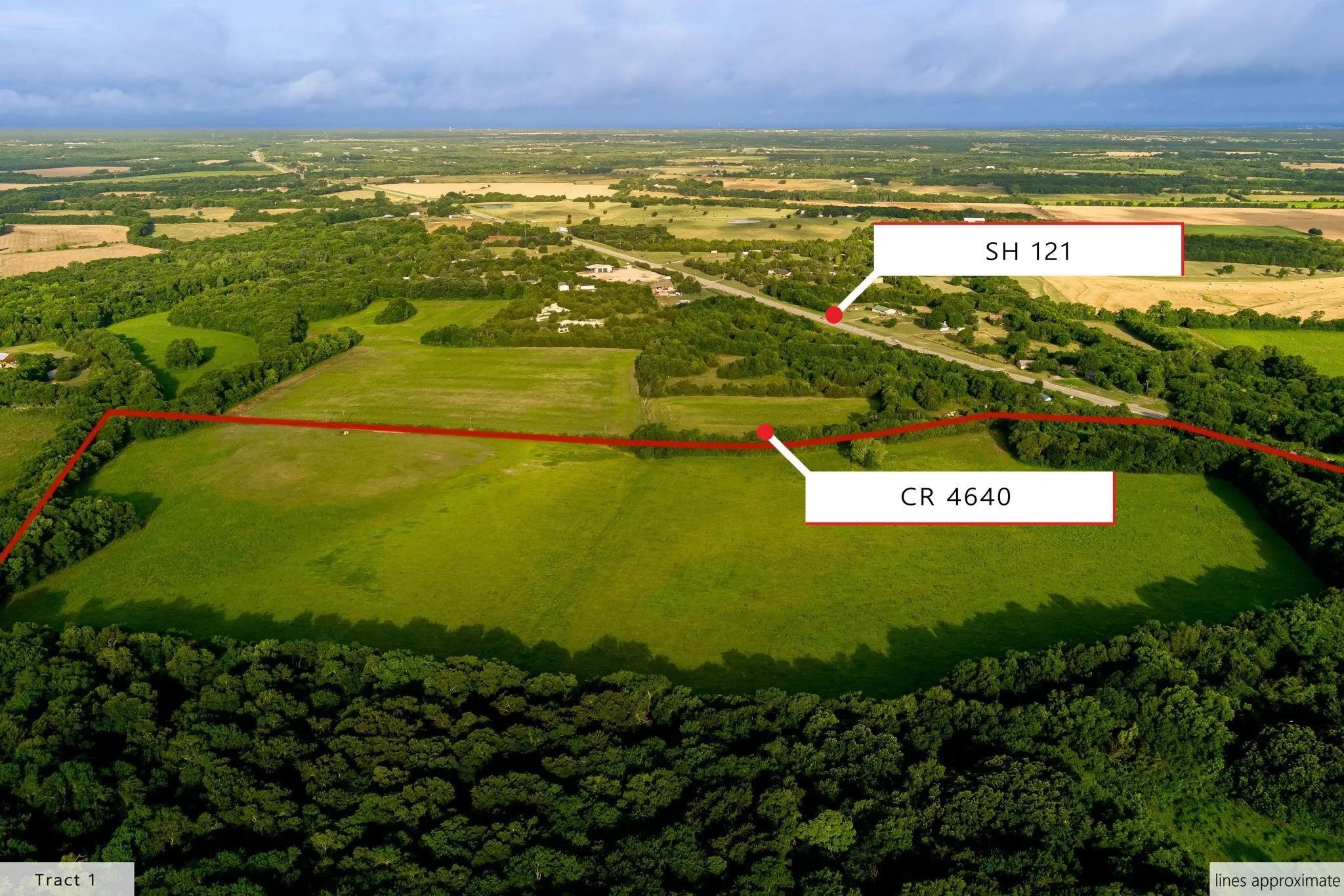Expansive green fields bordered by mature trees, with direct frontage on CR 4640 and proximity to SH 121