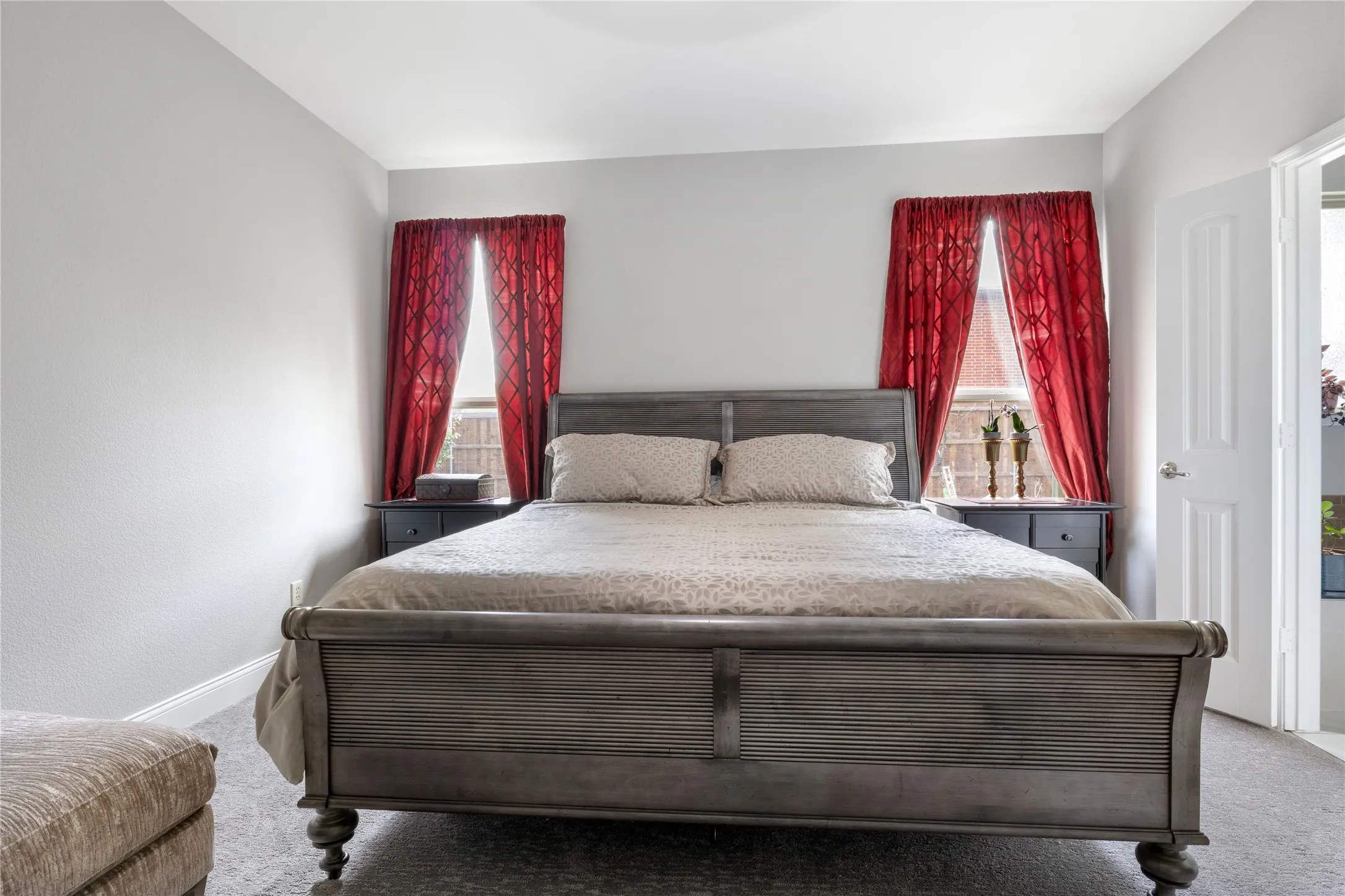 Neutral gray wall paint and textured gray carpeting