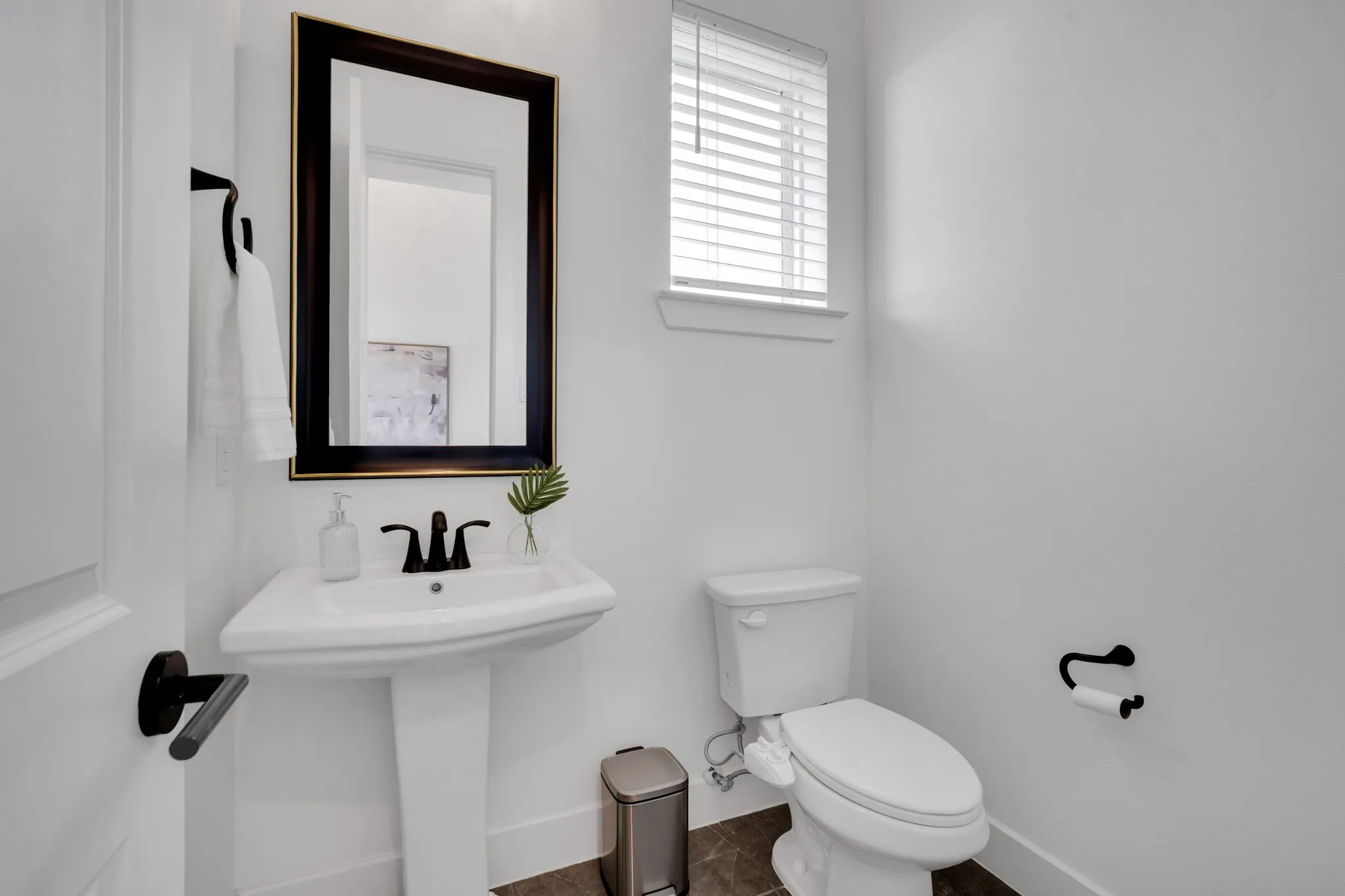 Half Bath is located just off the entry way in between Media Room and Office, convenient for guests!
