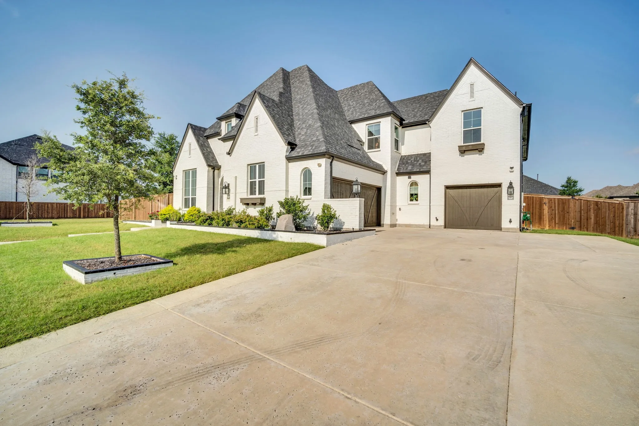 Home features 2 car swing garage and single garage.