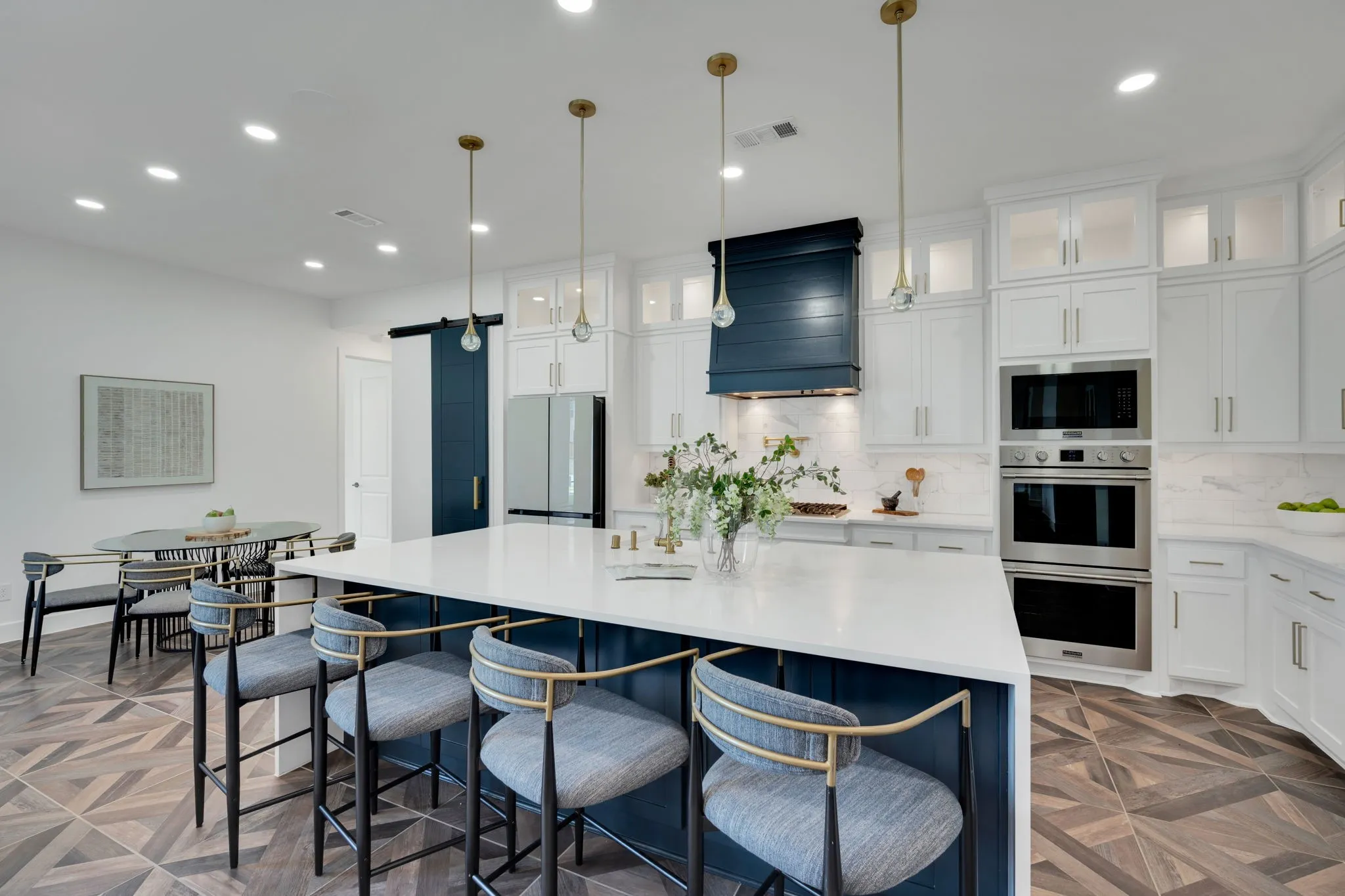 Kitchen features   Custom cabinetry with lighted uppers with glass doors complete the look.  You'll love your gas range, pot filler double oven- all perfect for the chef in your family!