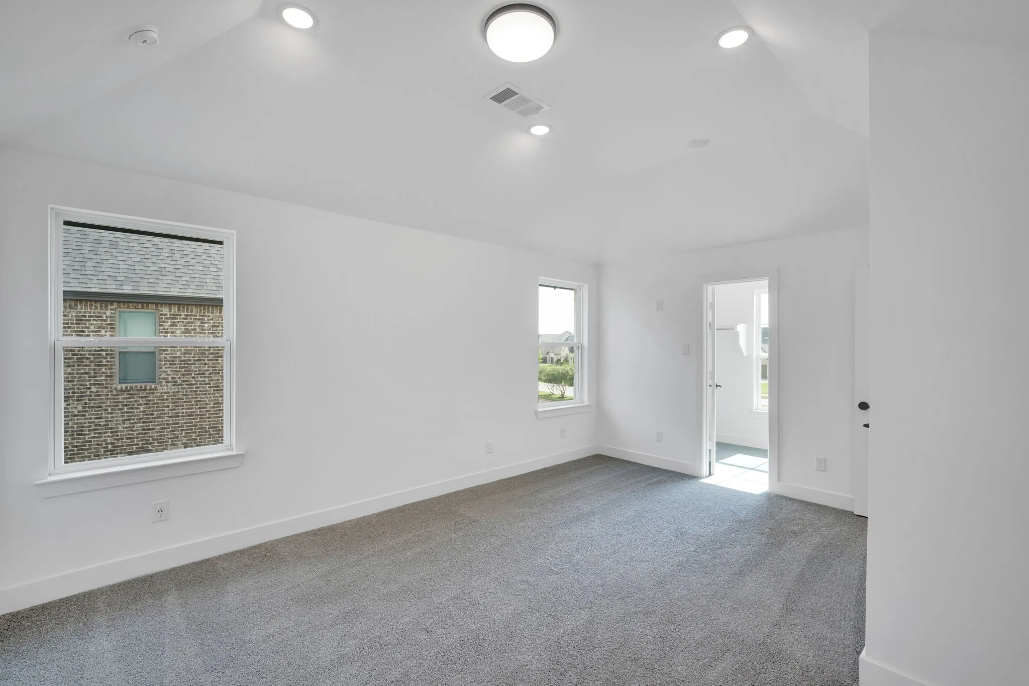 Second Primary Bedroom is located upstairs, features ensuite bathroom with seperate shower and garden tub, walk in closet and oversized bedroom space.