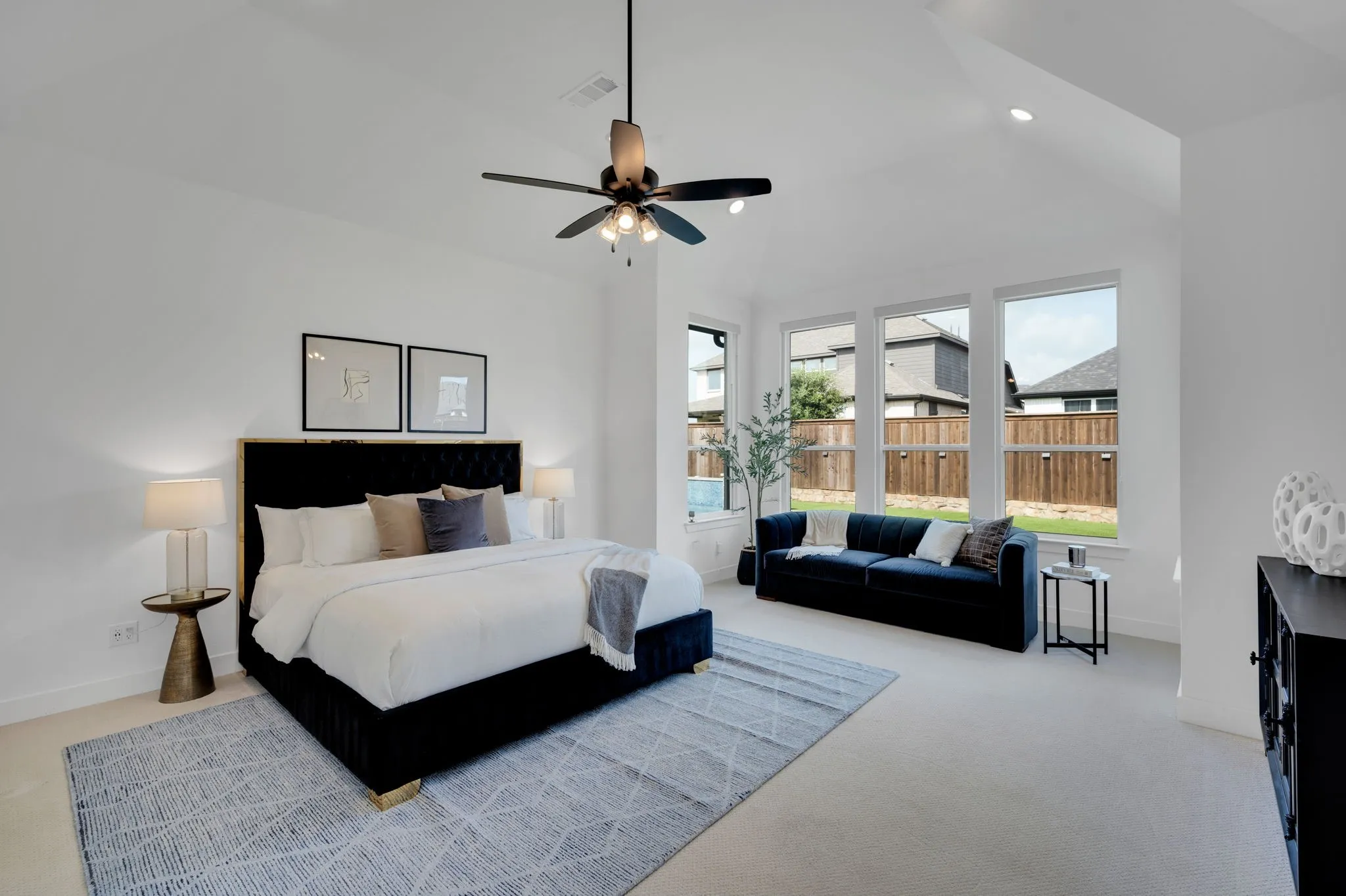 Primary Retreat with custom shades, allows natural light into the room overlooking your gorgeous backyard but privacy when desired.