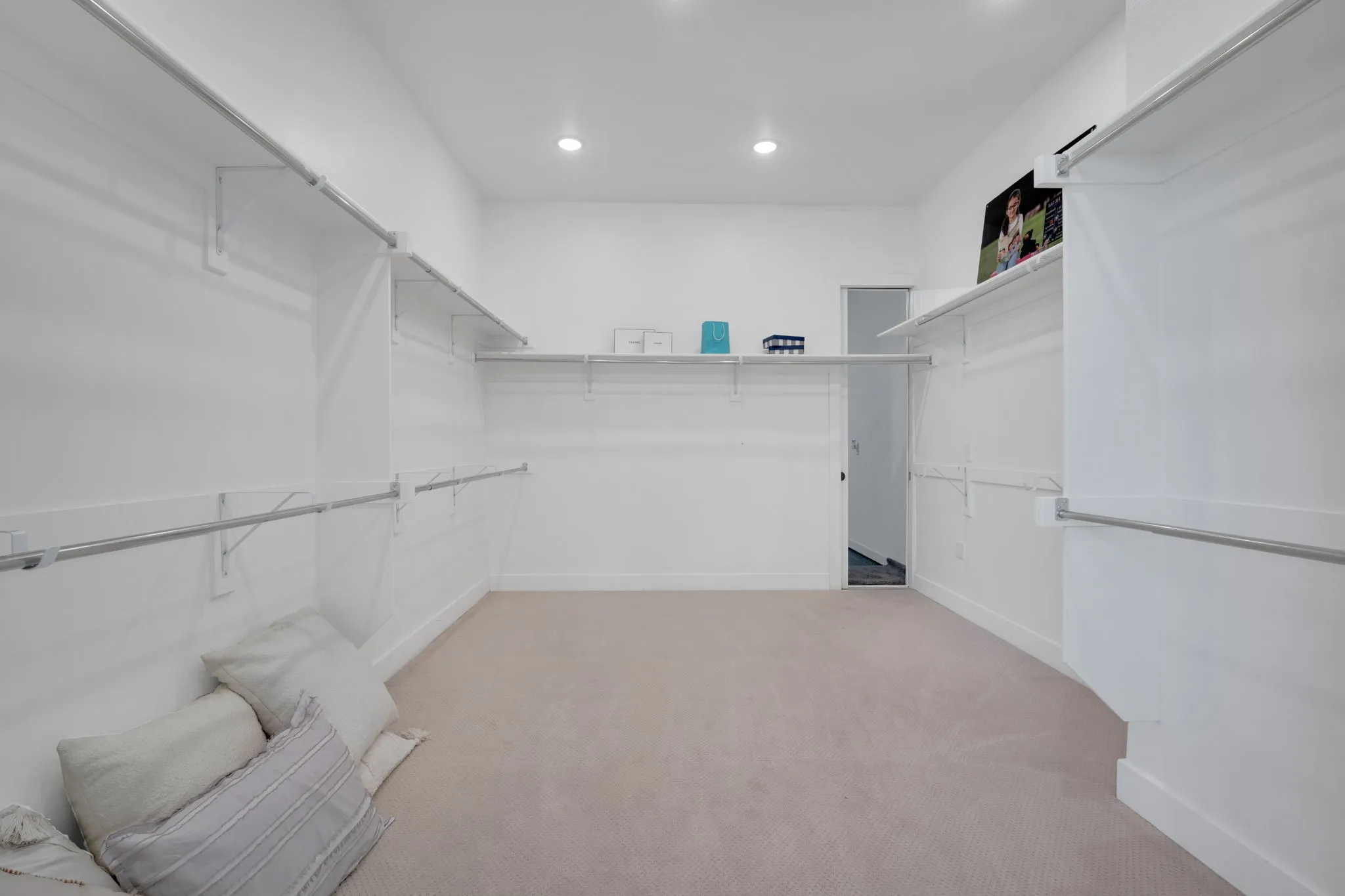 Primary closet is huge, designed to give everyone ample space.
