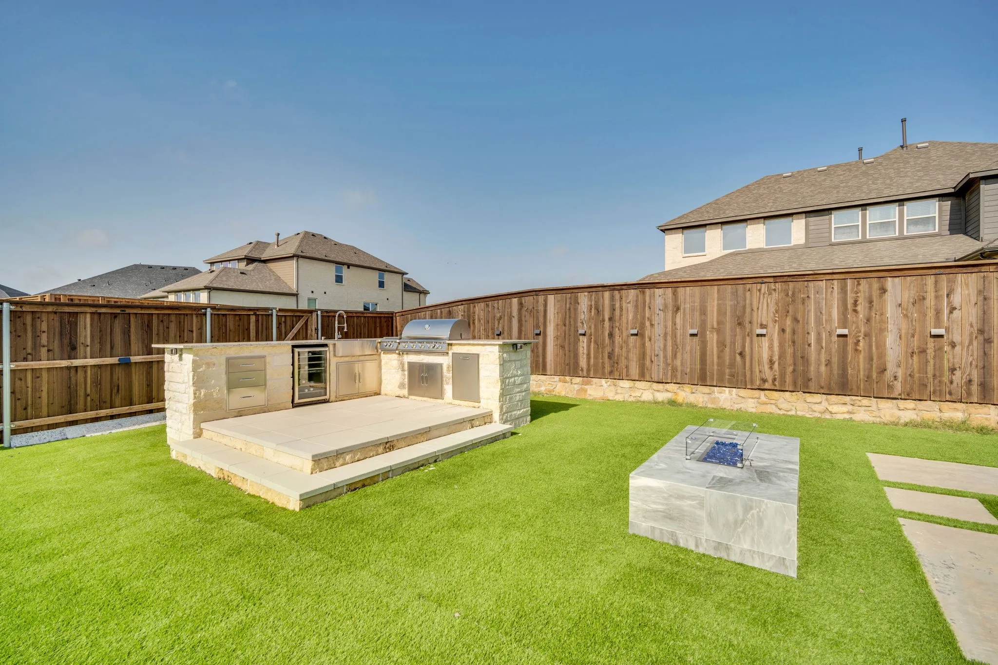 Gourmet outdoor kitchen and fire pit is ready for those summer nights!