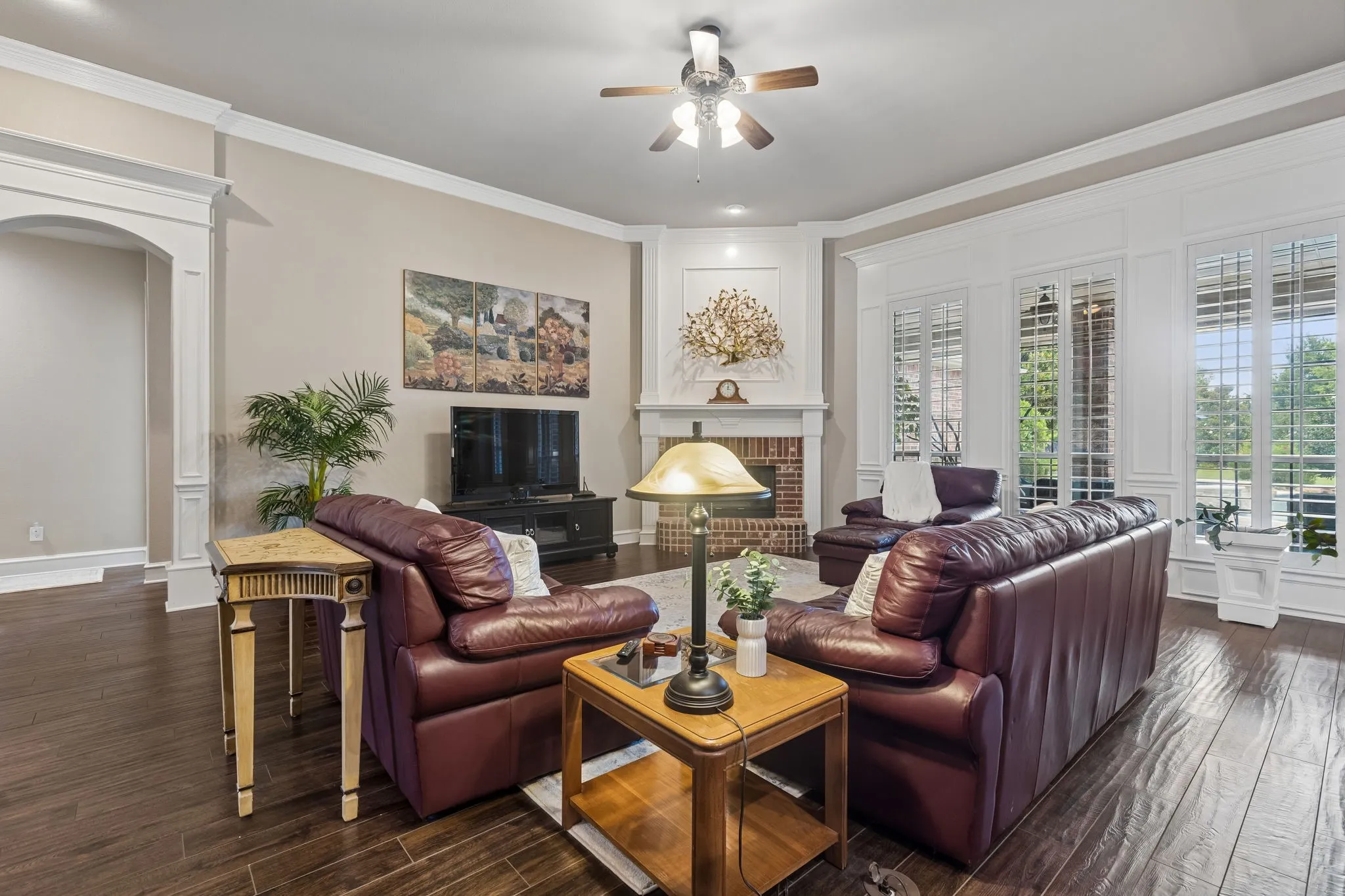Another view of the main living space showing off the gorgeous windows and fireplace.