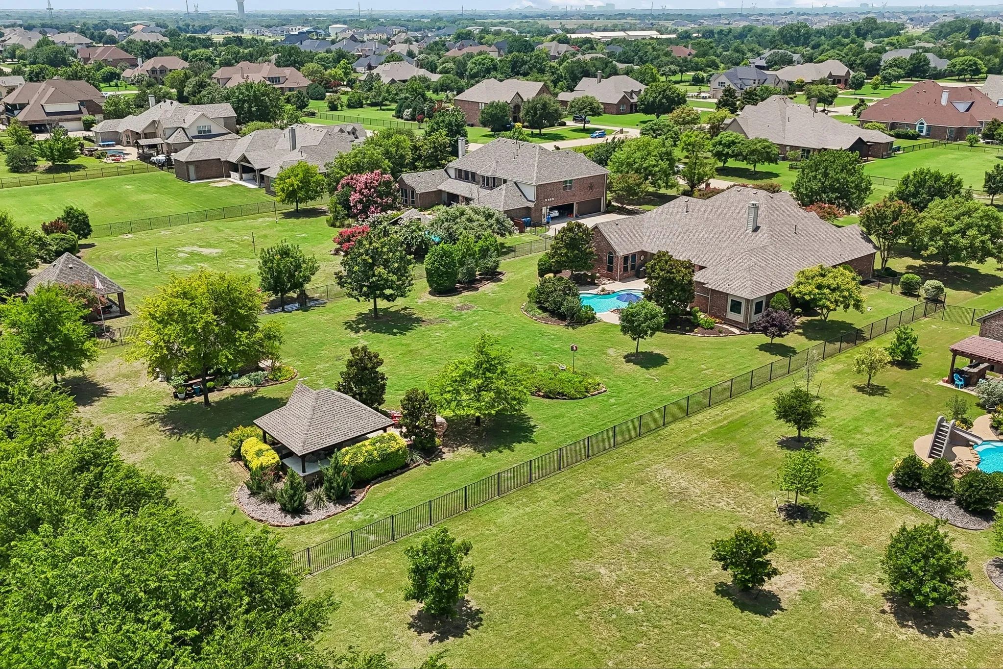 Aerial view showing off the stunning 1 acre property!