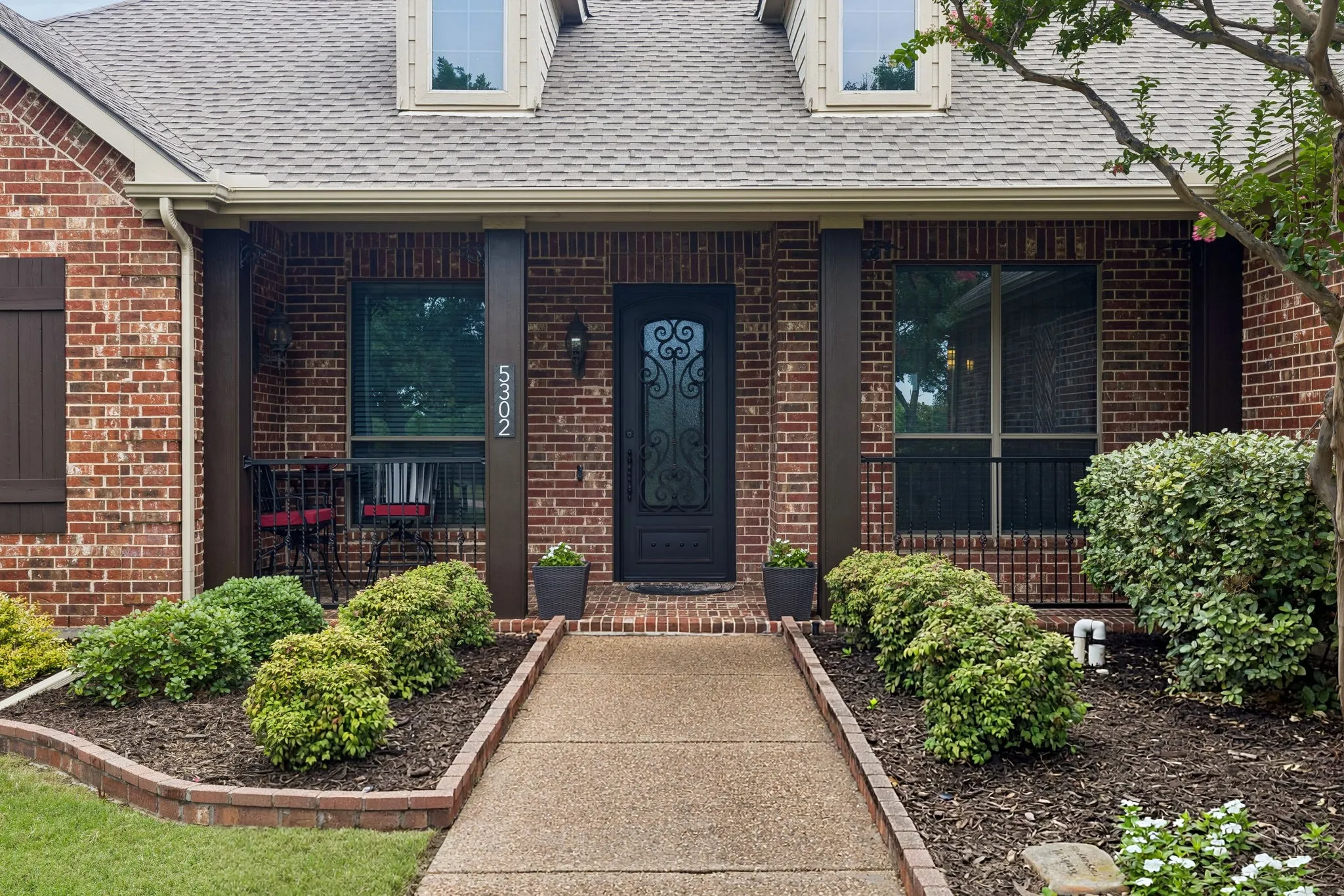 But wait.... theres more! Towards the back of the 1 acre property you will find a stunning outdoor living area with cedar posts and cedar plank roof, counter area with wood storage for fire pit, stone accents, amazing foliage, and stone border beds!