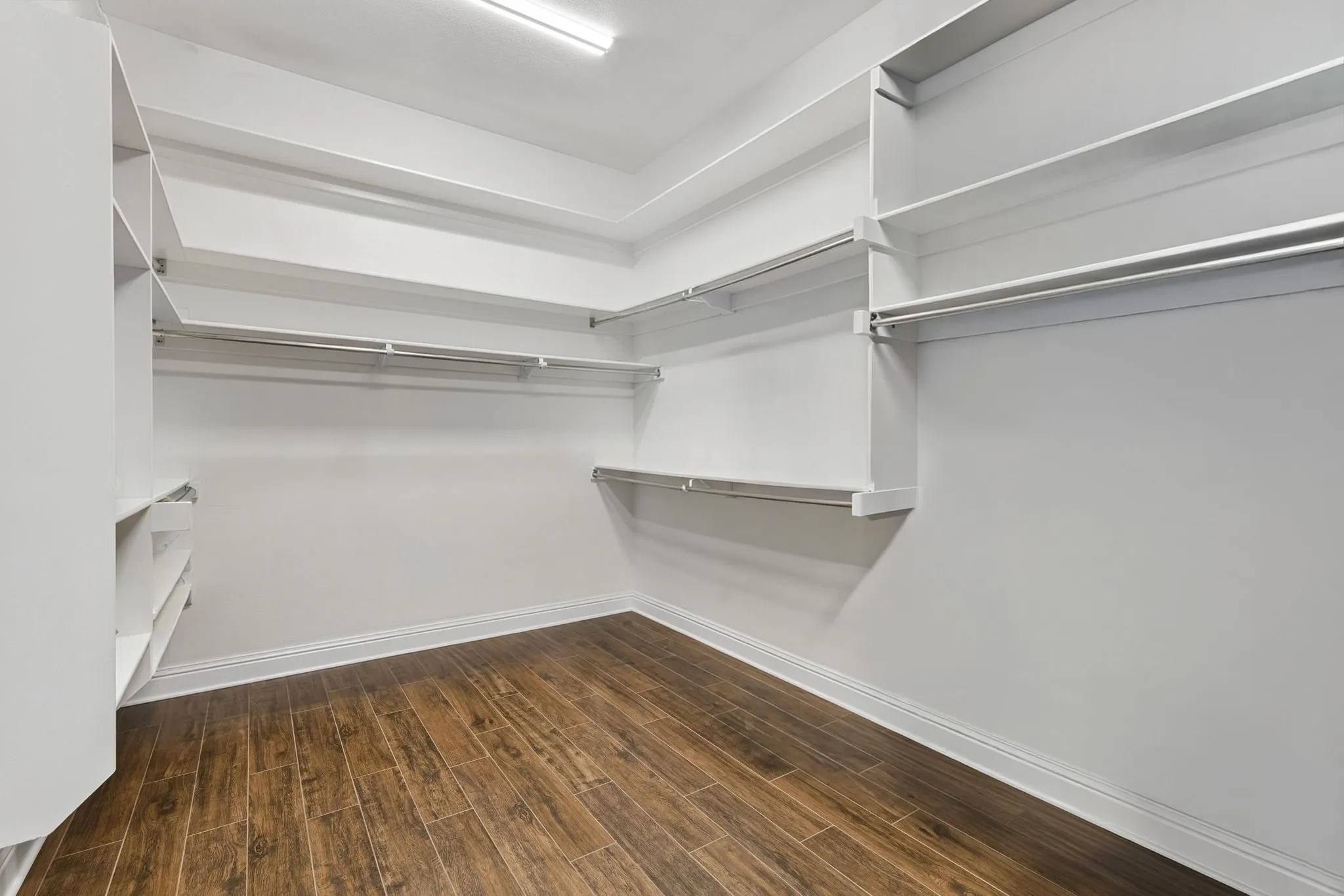 Another view of the primary bedroom showing off its amazing size and natural light!
