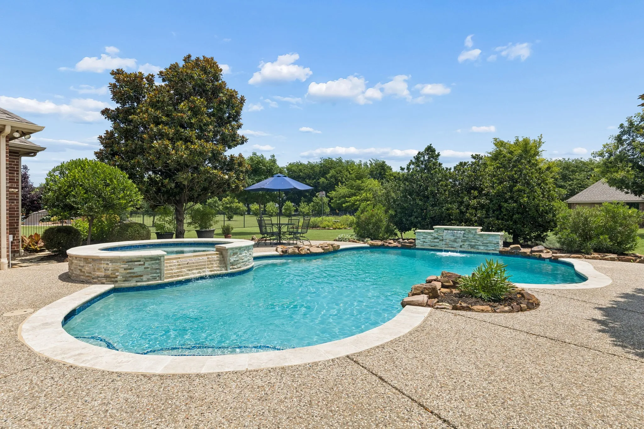 The perfect place to spend the rest of the summer! This stunning pool and spa boast two stunning water features.
