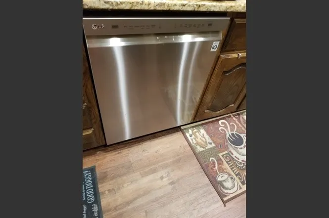 Flooring extends into kitchen and baths