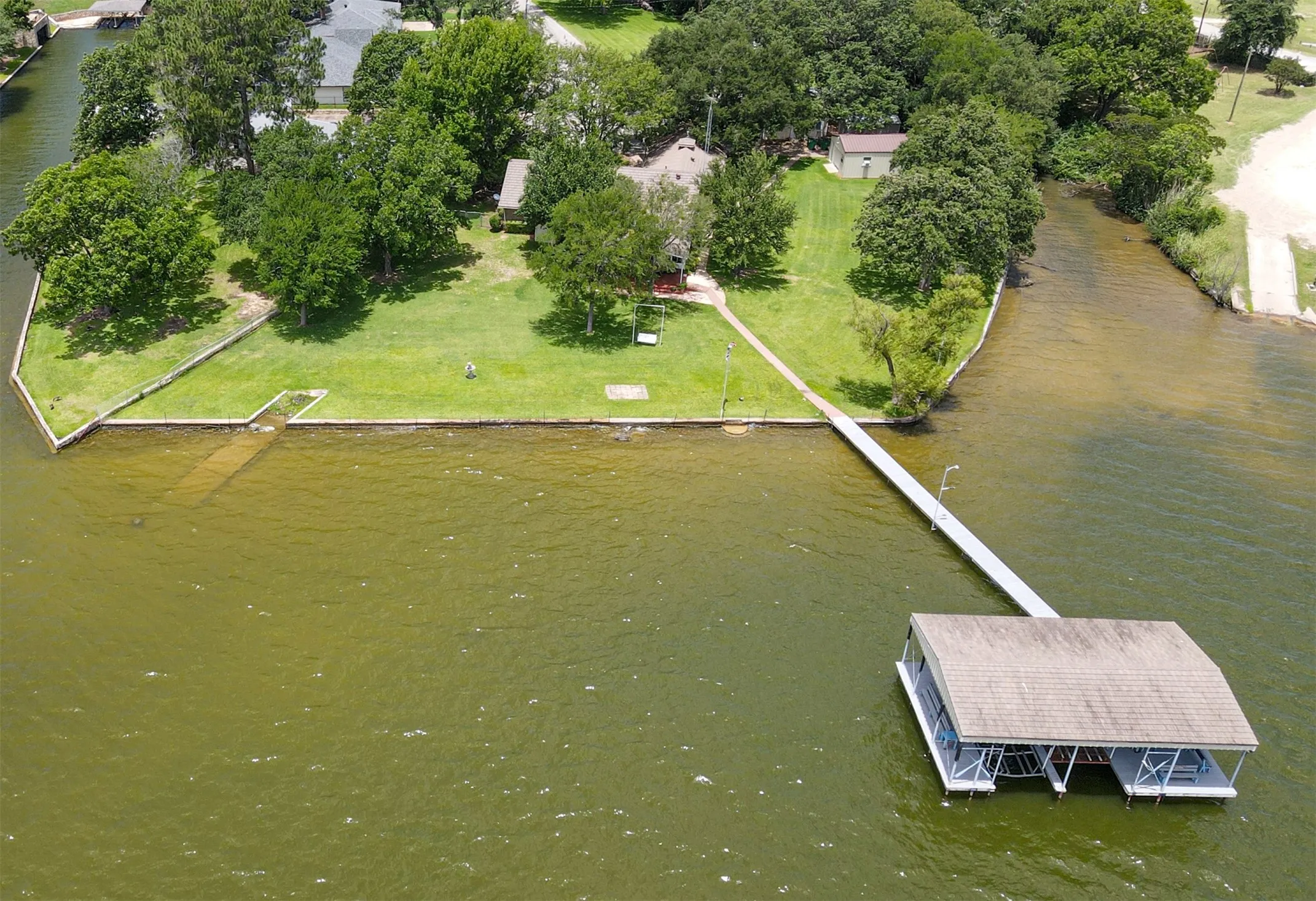 Head on view of the property lake frontage and don't forget about the canal on the side! Fishing!
