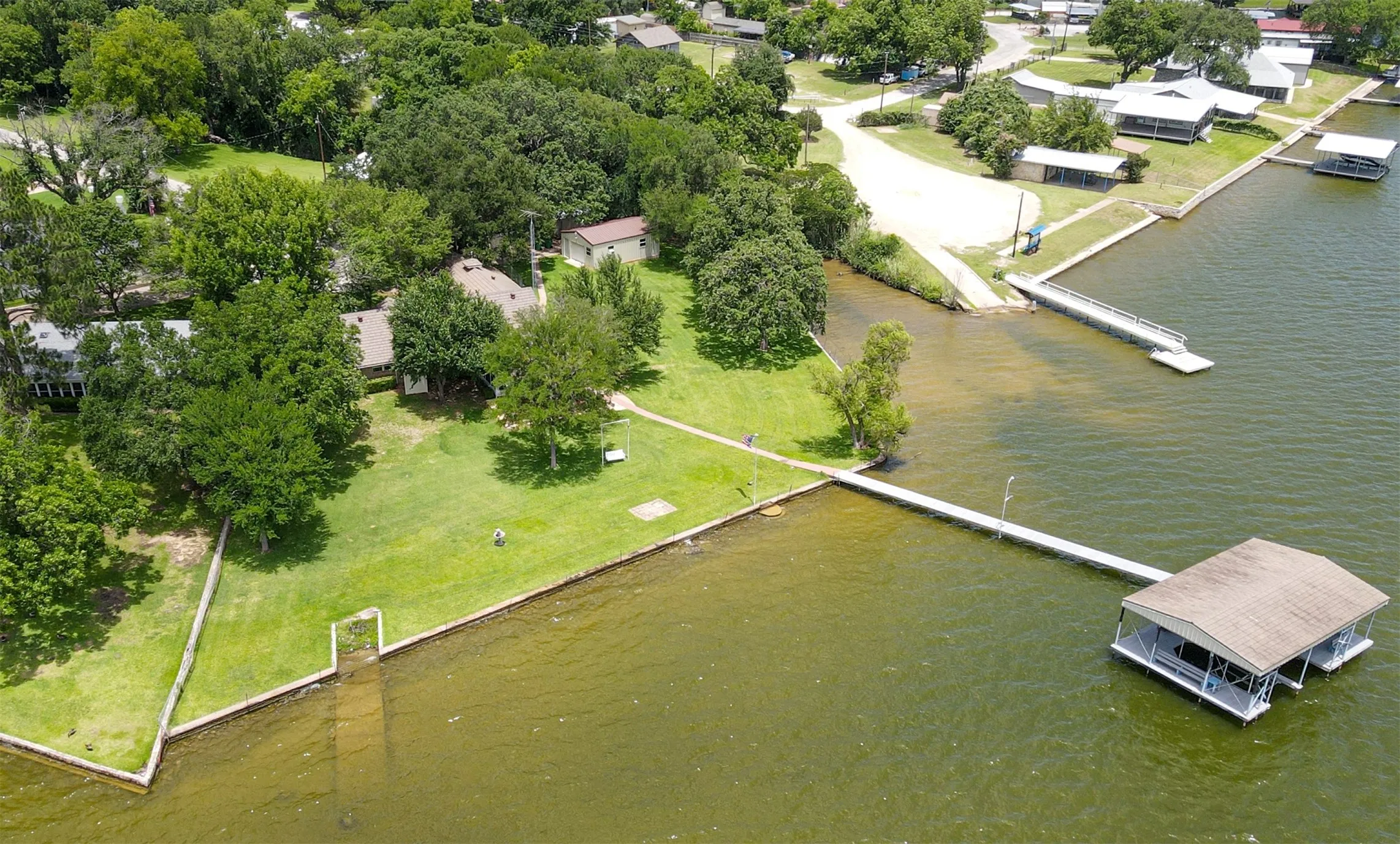 Approaching from the southern end. Property line stops where the wall looking structure is.
