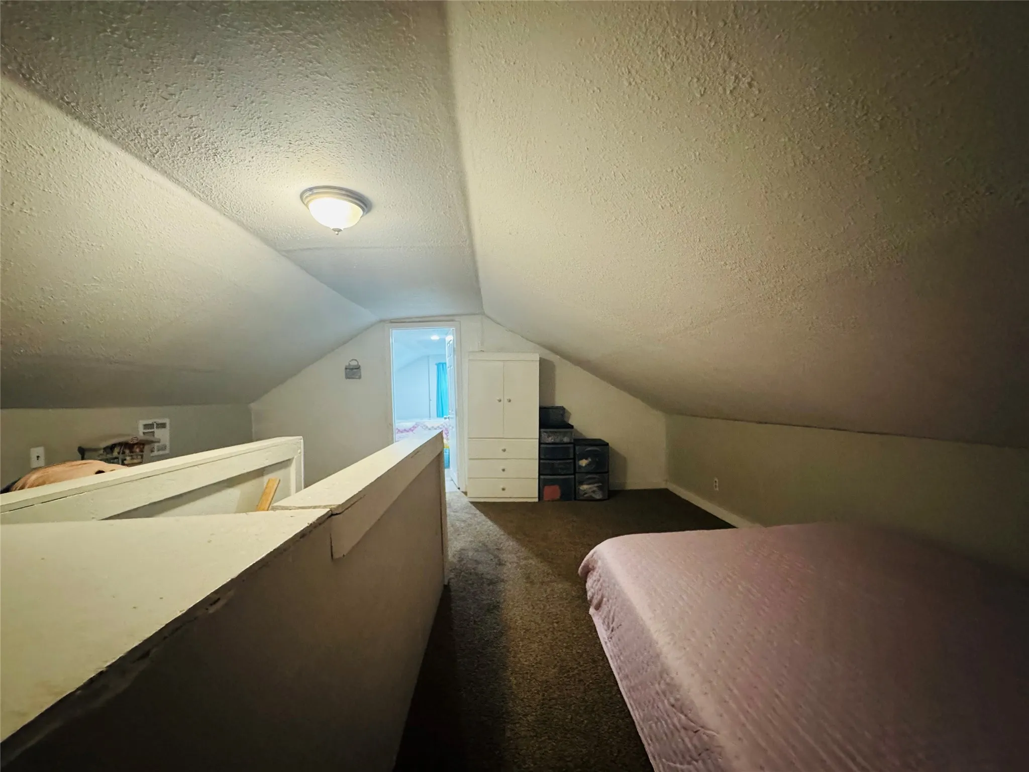 Sloped ceiling design with flush-mount lighting