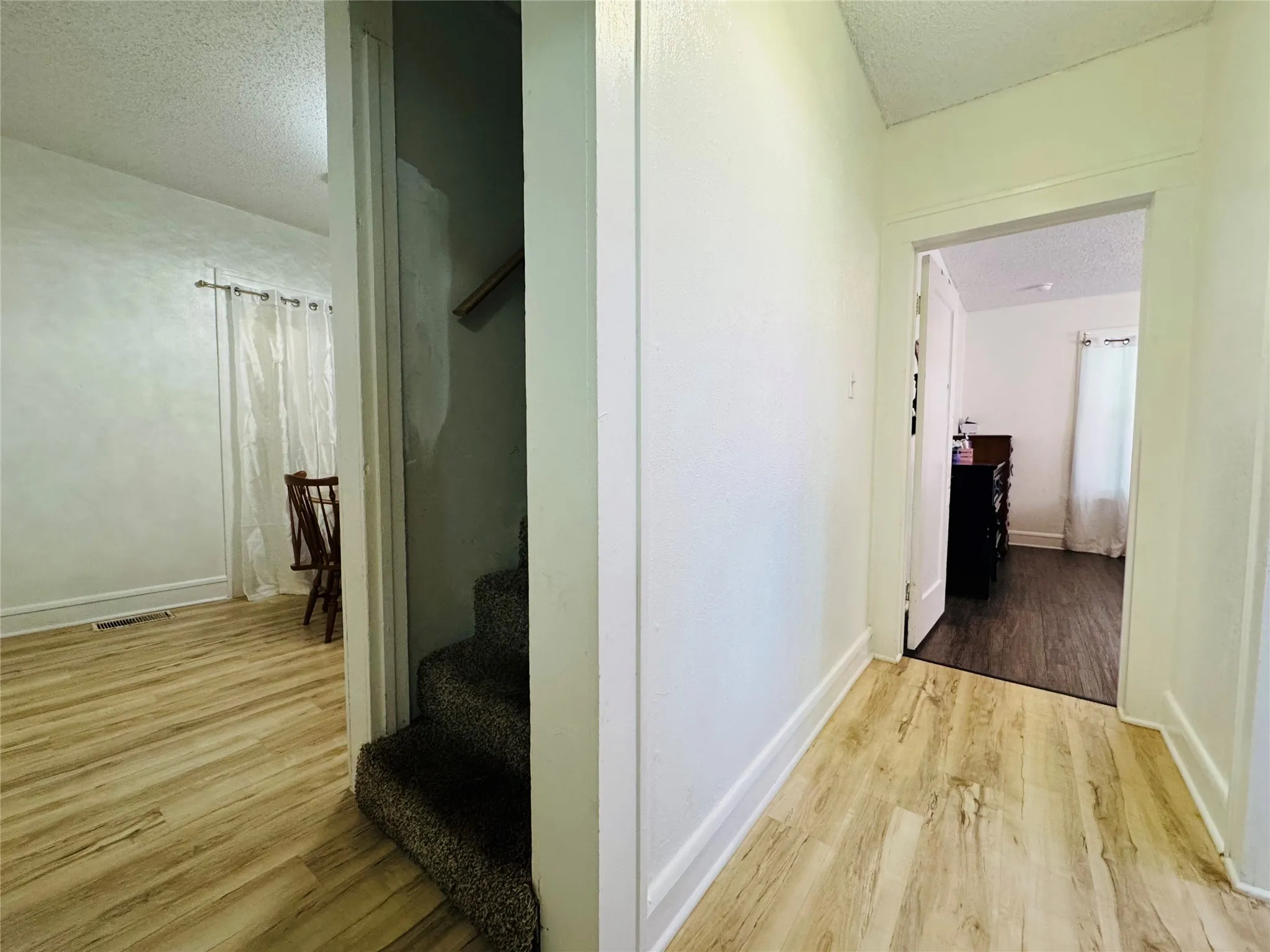Entryway featuring light wood-finish flooring, white walls, and bright white trim