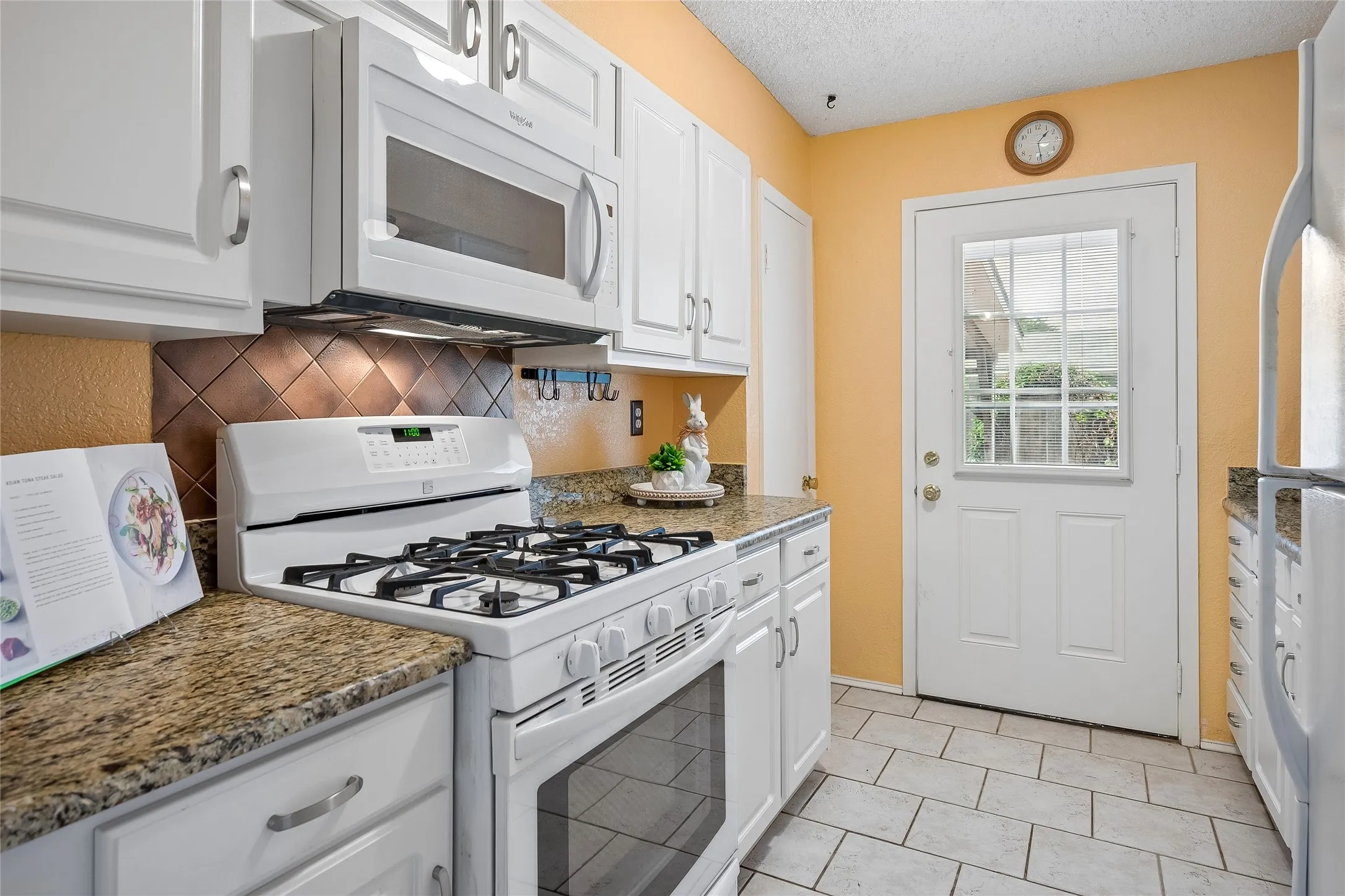 Nice updated cabinets and built-in microwave.