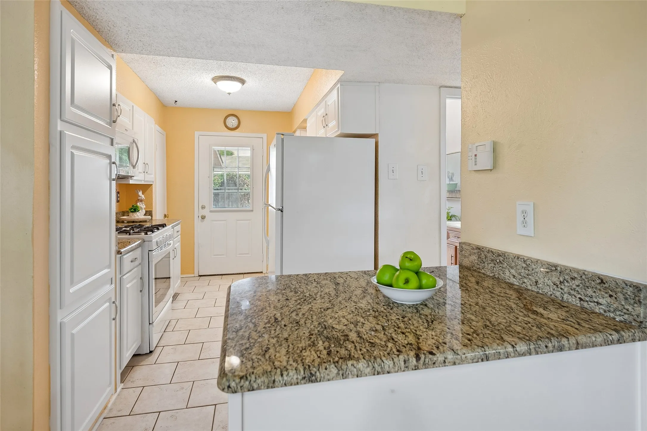Granite serving counter with fridge included.