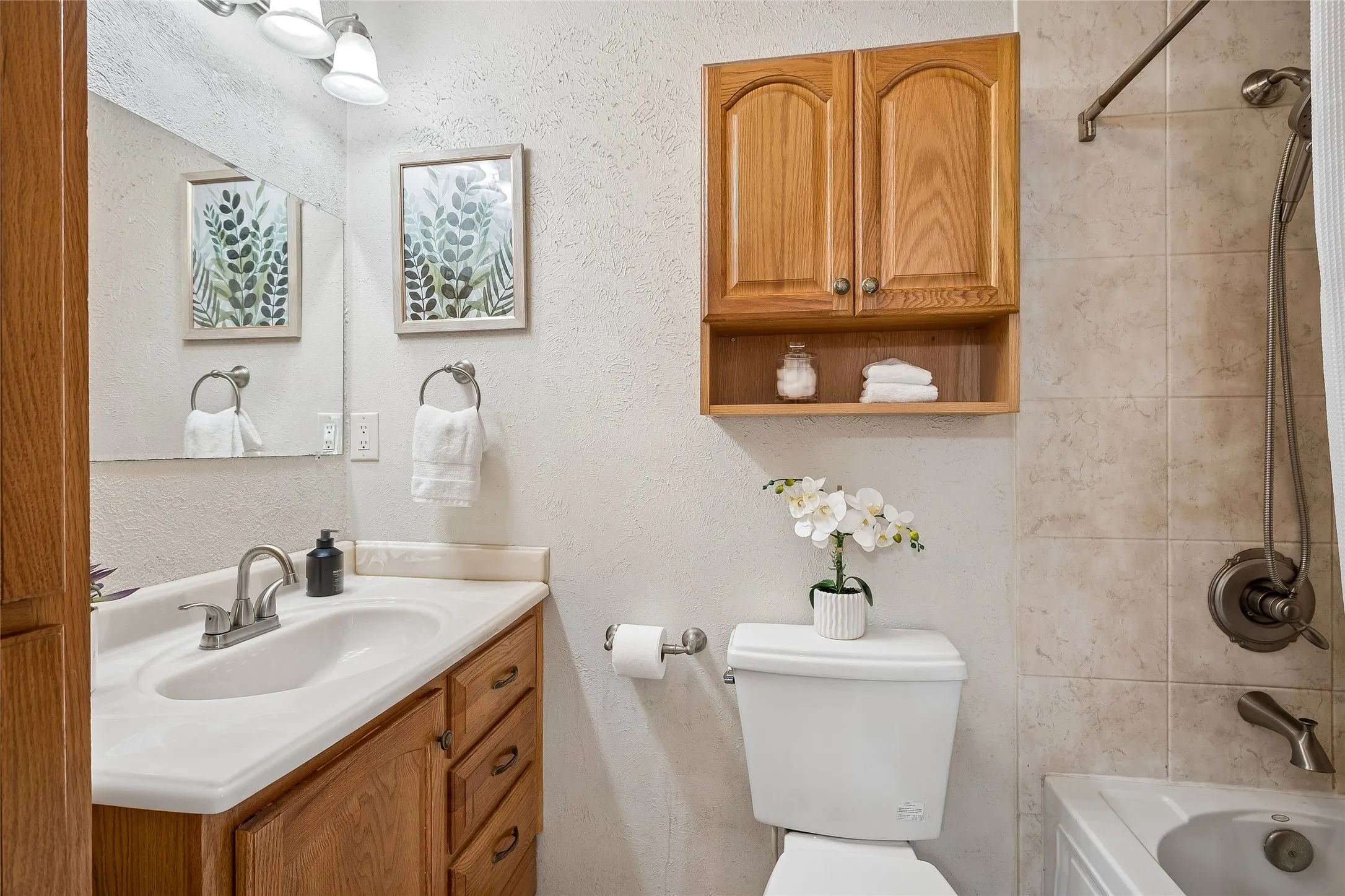 Primary ensuite bath with updated brushed nickel fixtures.