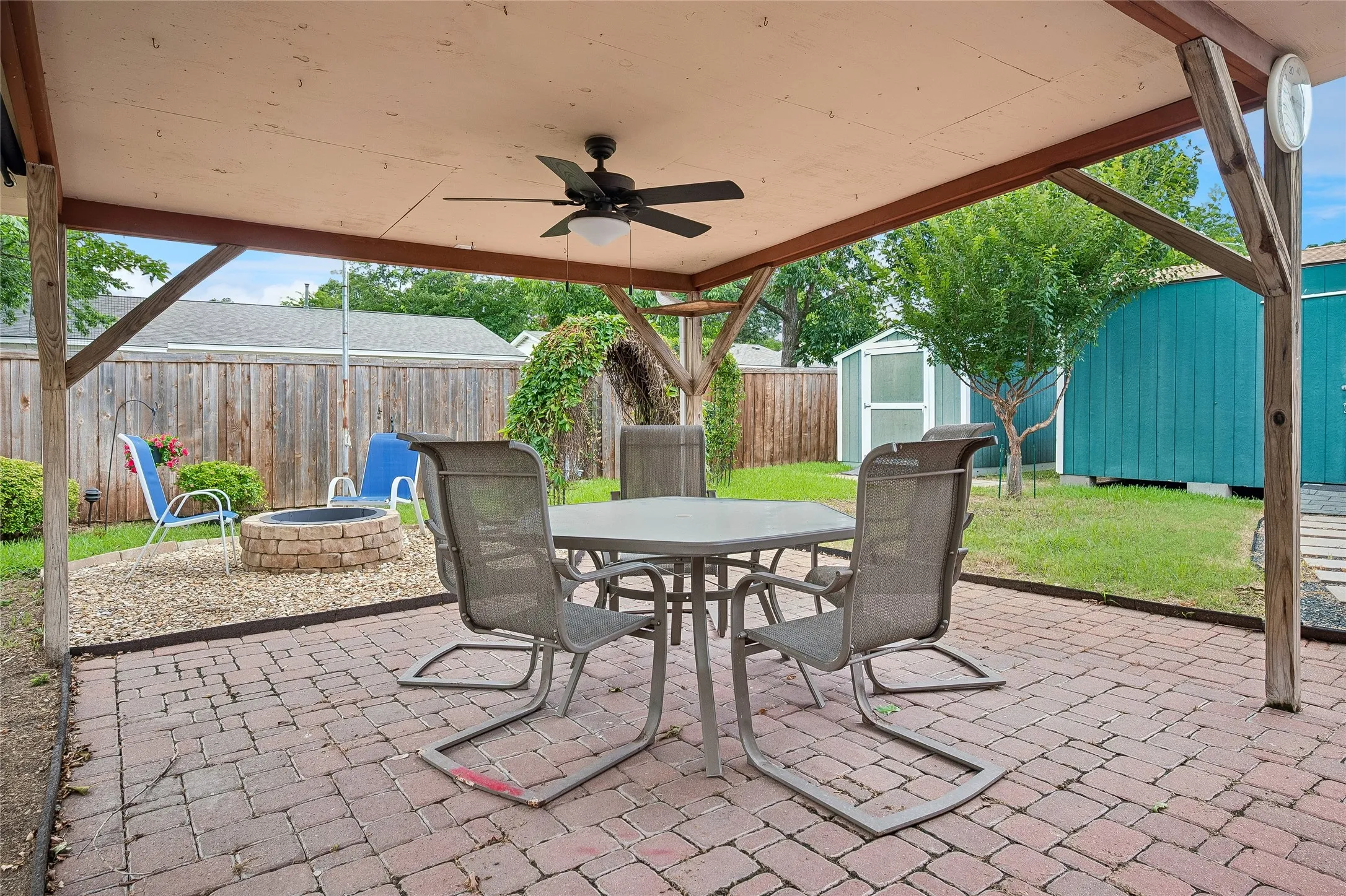 Chill out beneath the fan cooled covered patio. Nice wood privacy fence surrounds yard.