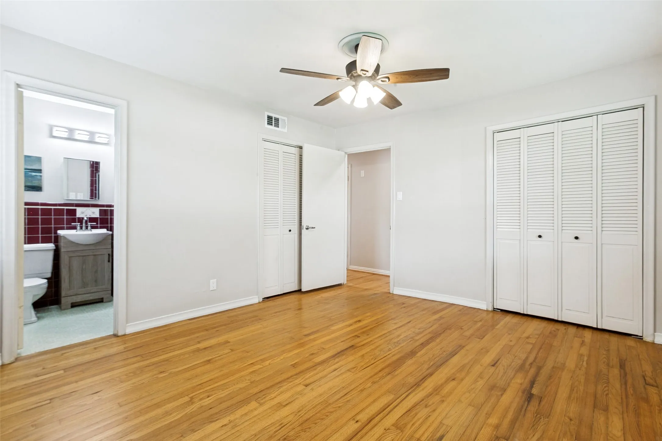 Front Bedroom has TWO closets and a private bath with shower.