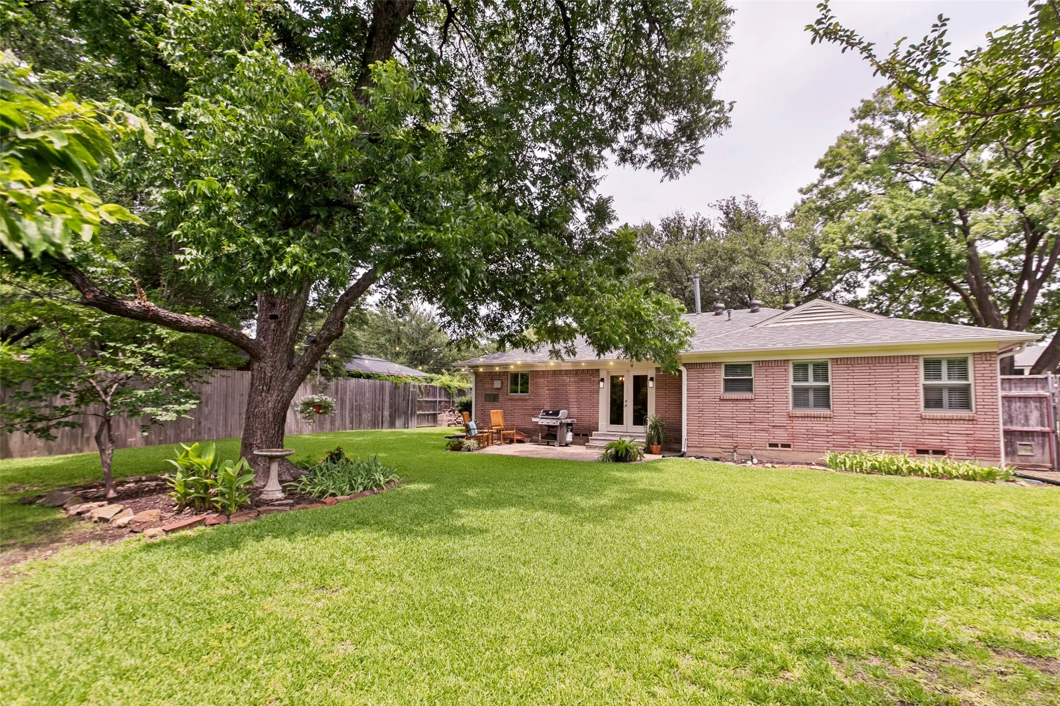 Large shaded back yard is a delight for pets, play and entertaining!