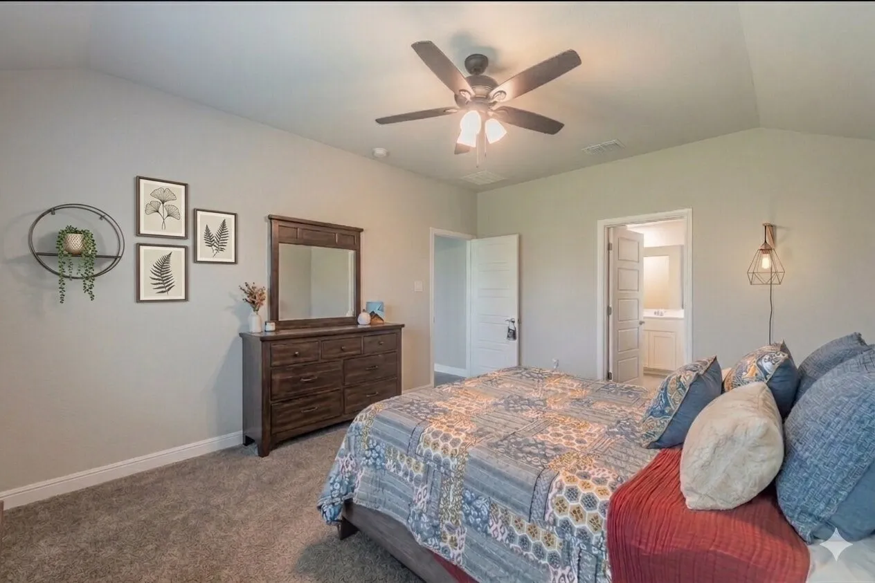 Another view of primary bedroom