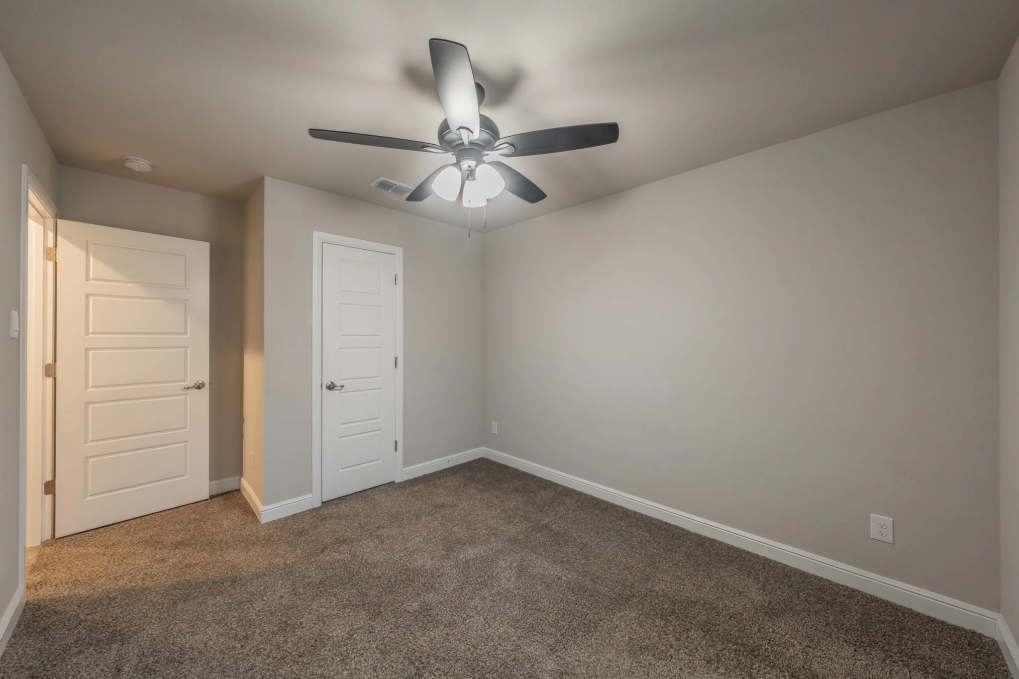 Bedroom #2 with ceiling fan and walk in closet