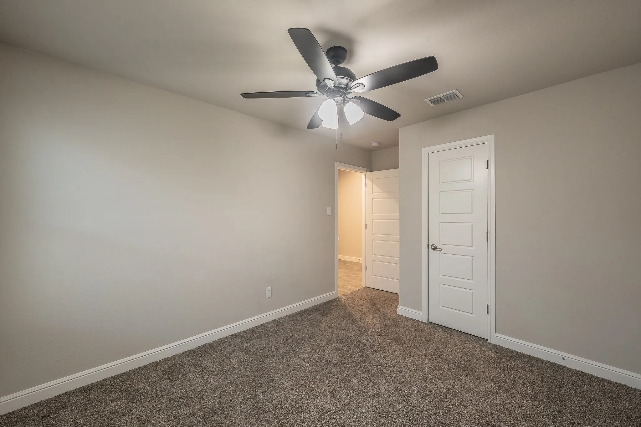 Bedroom #3 with ceiling fan and walk in closet
