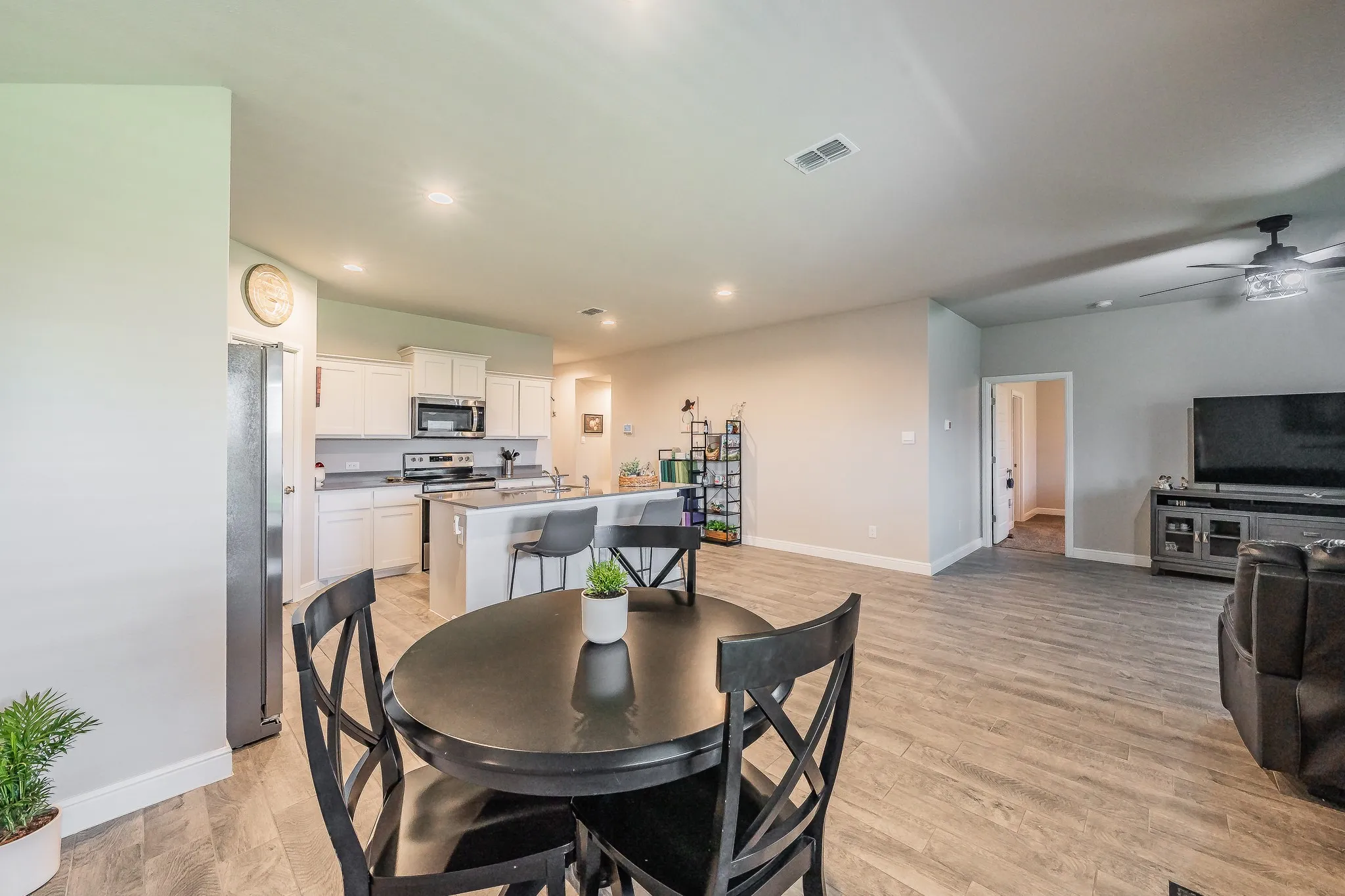 Open-concept living space featuring ceramic plank tile flooring throughout