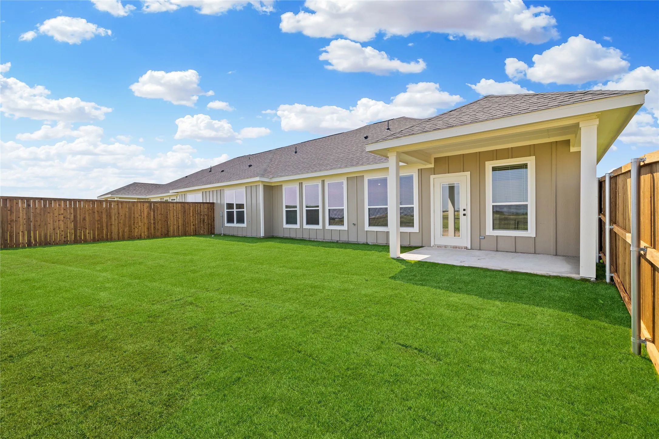 Expansive green lawn providing abundant outdoor space