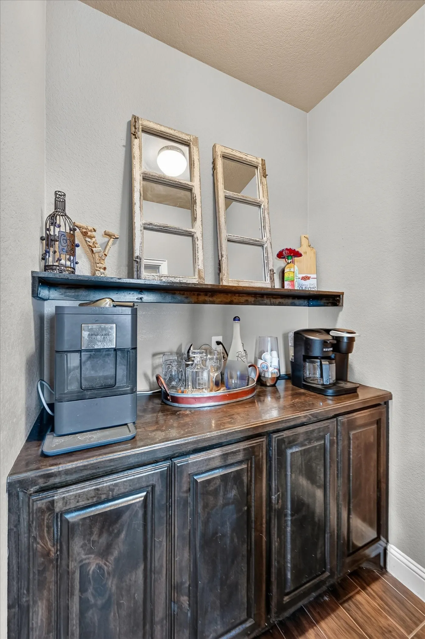 Built-in custom cabinetry with a dark wood finish and panel detailing, topped with a coordinating countertop
