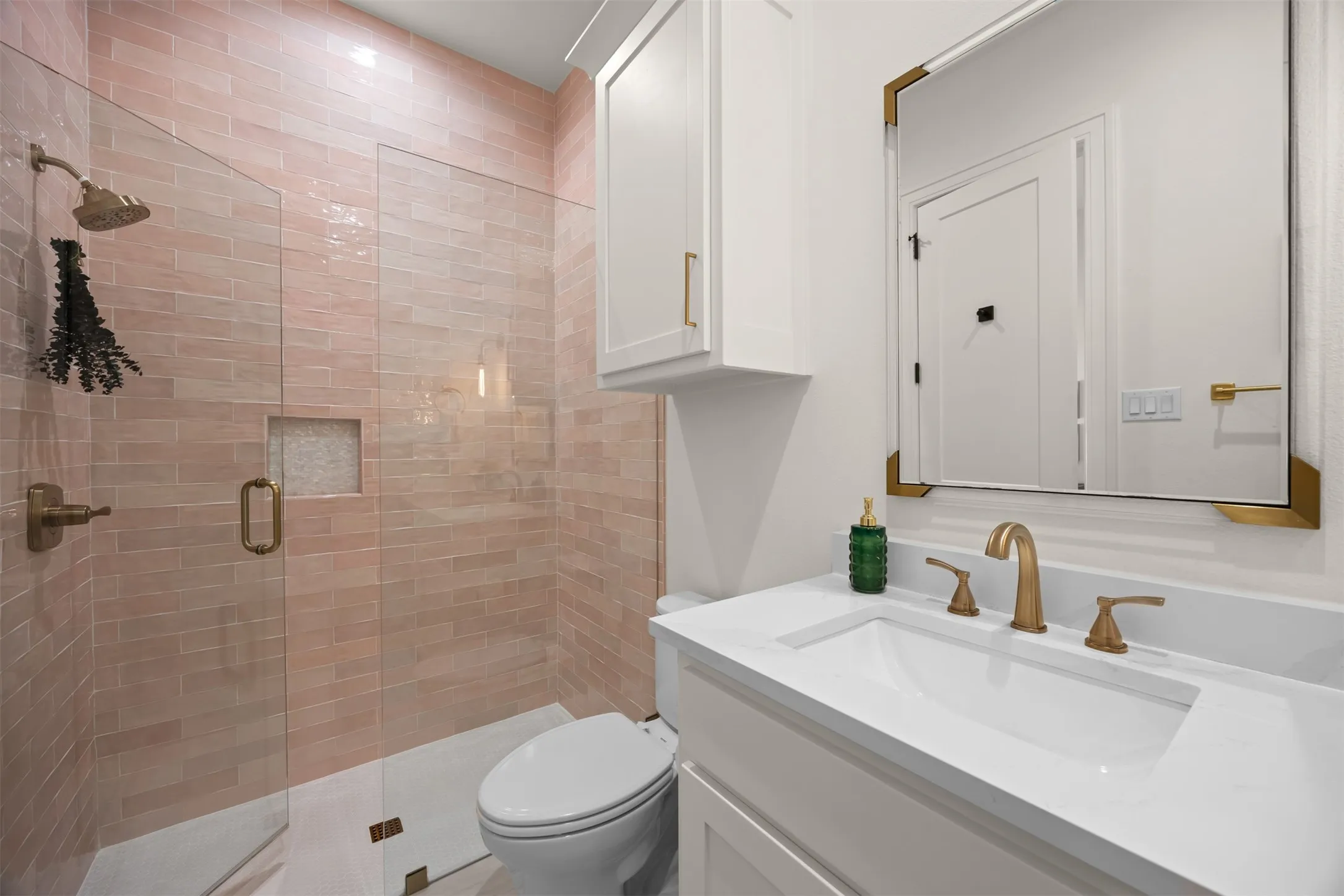 Stylish and sophisticated tile, frameless shower & custom mirror makes the ideal ensuite