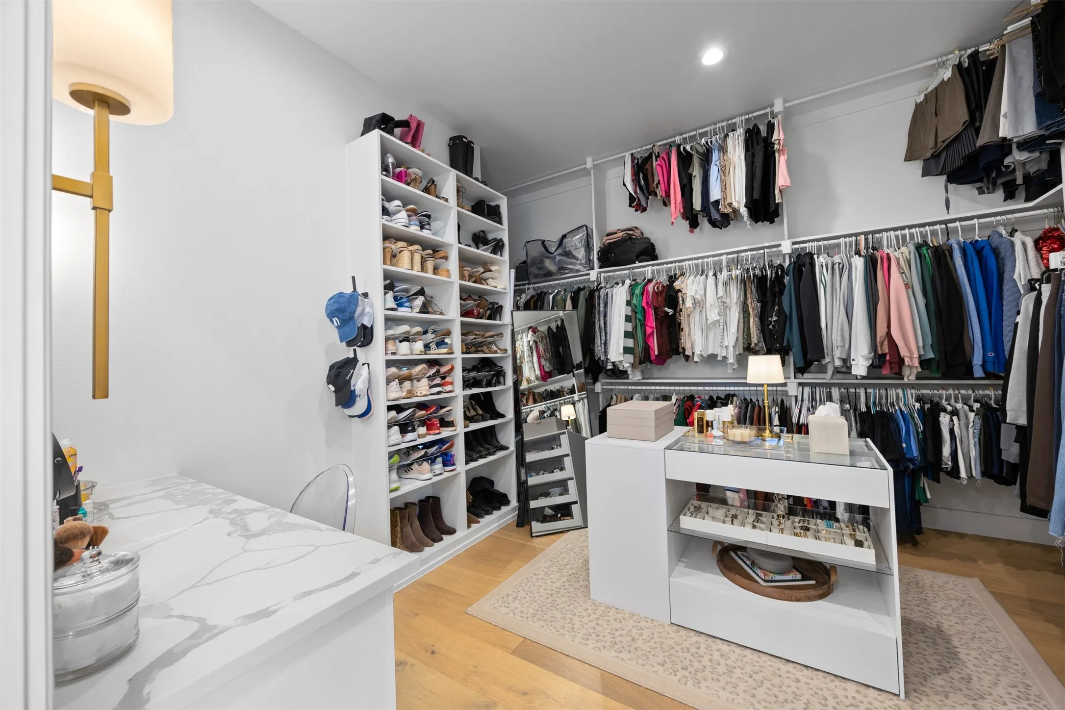 Dual closets offer plenty of storage and this one is complete with a private vanity!