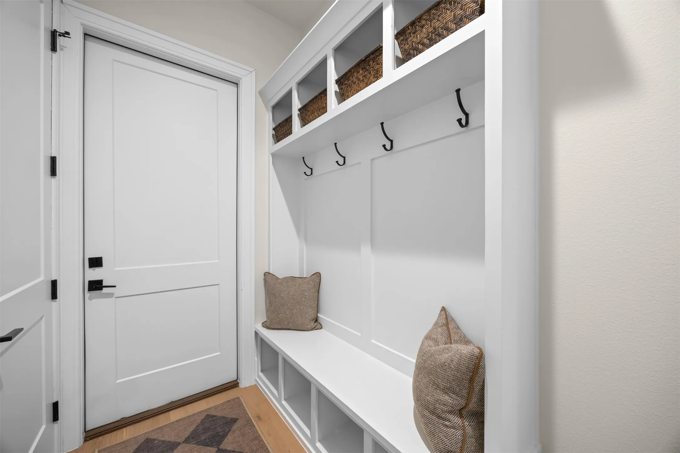 A convenient spot, right off the garage, to drop off your bags