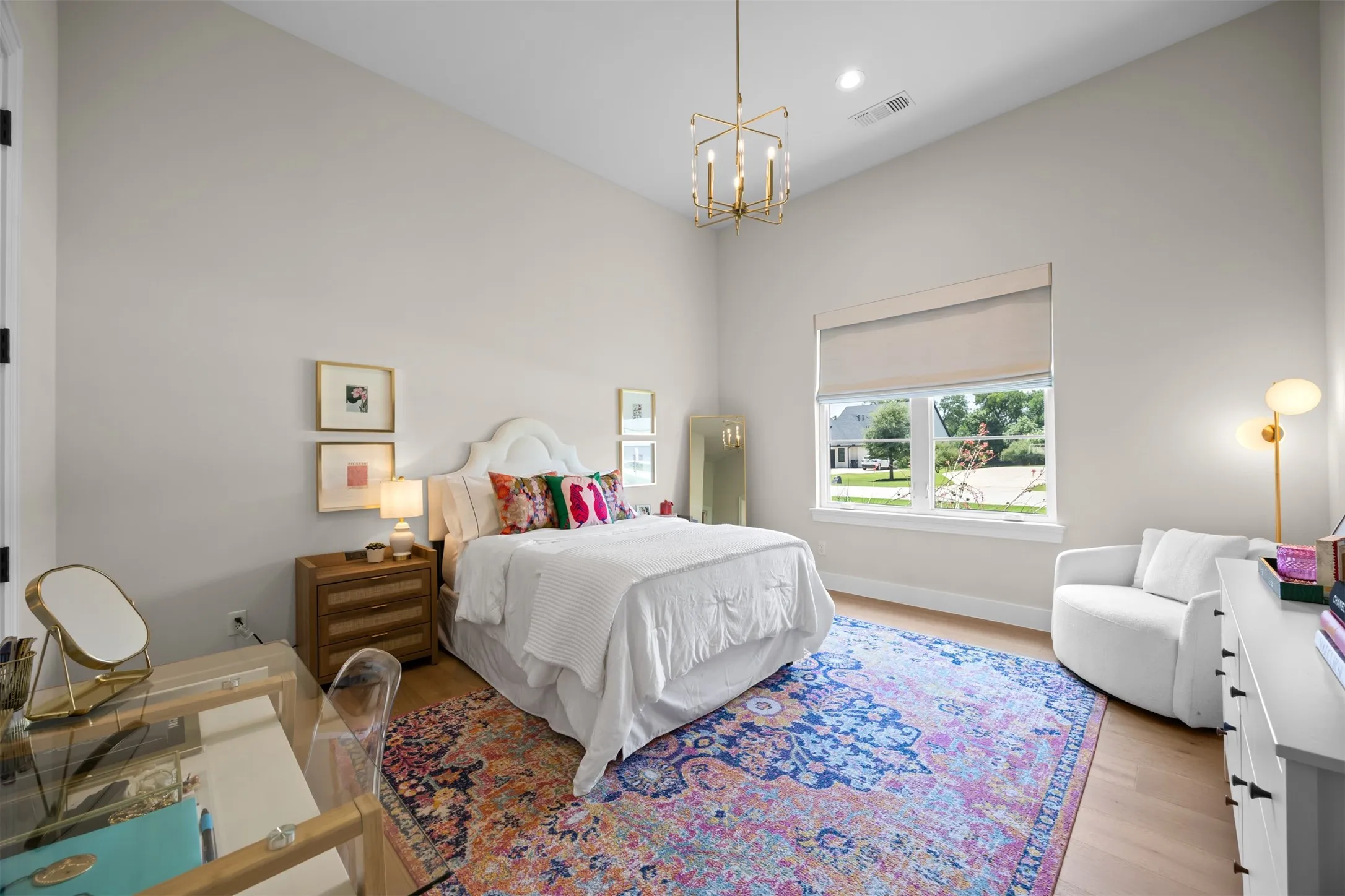 Generously sized secondary bedroom with soaring ceilings, a large closet & lovely ensuite bath