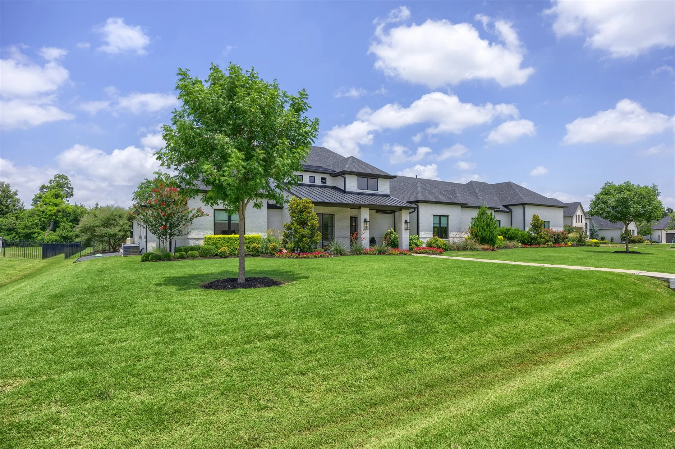 Enjoy lush, manicured landscaping in this picturesque setting offering space & privacy in a gated community.
