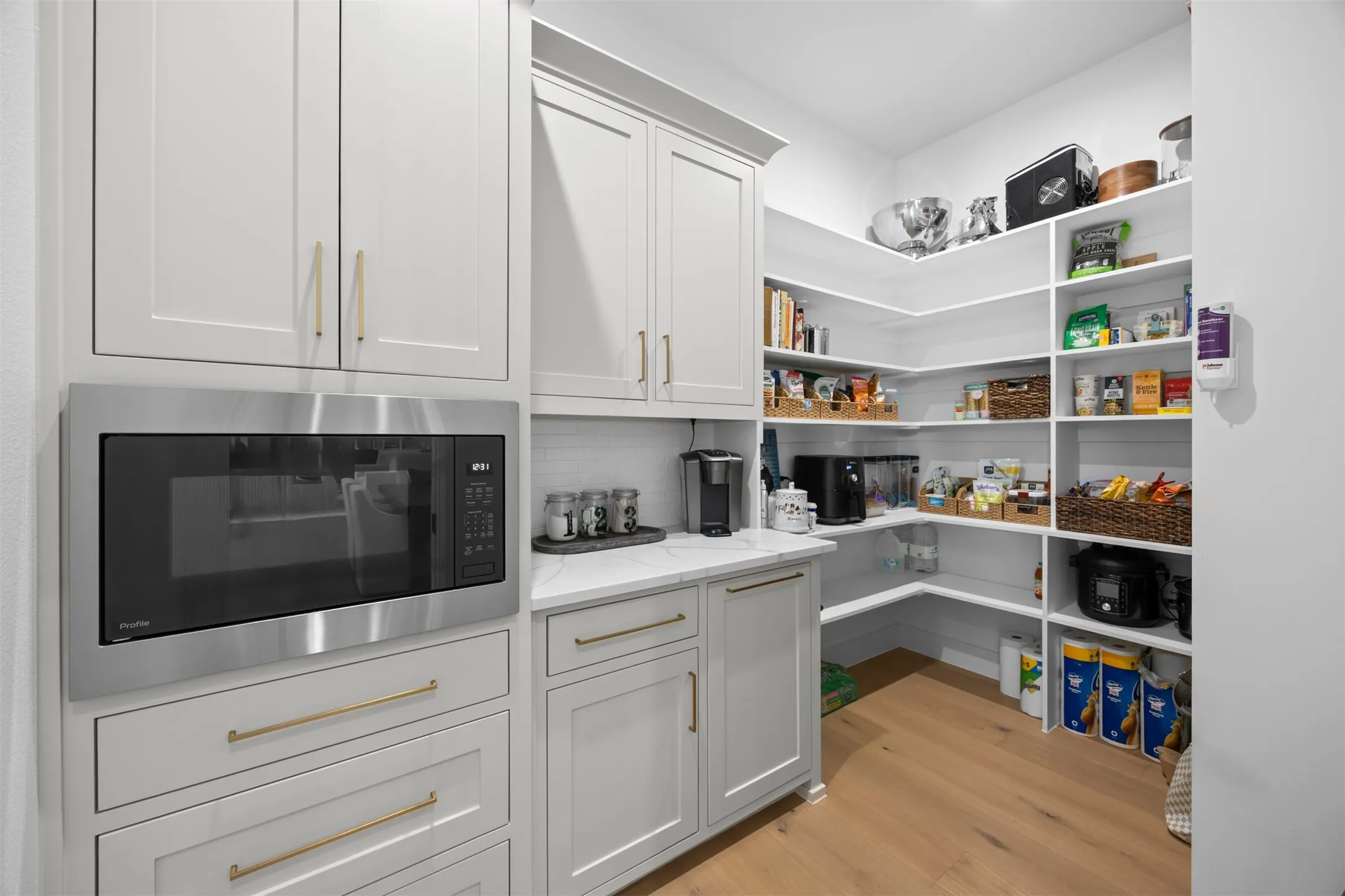 An exceptional walk in pantry designed to delight even the most discerning chef. So much storage!