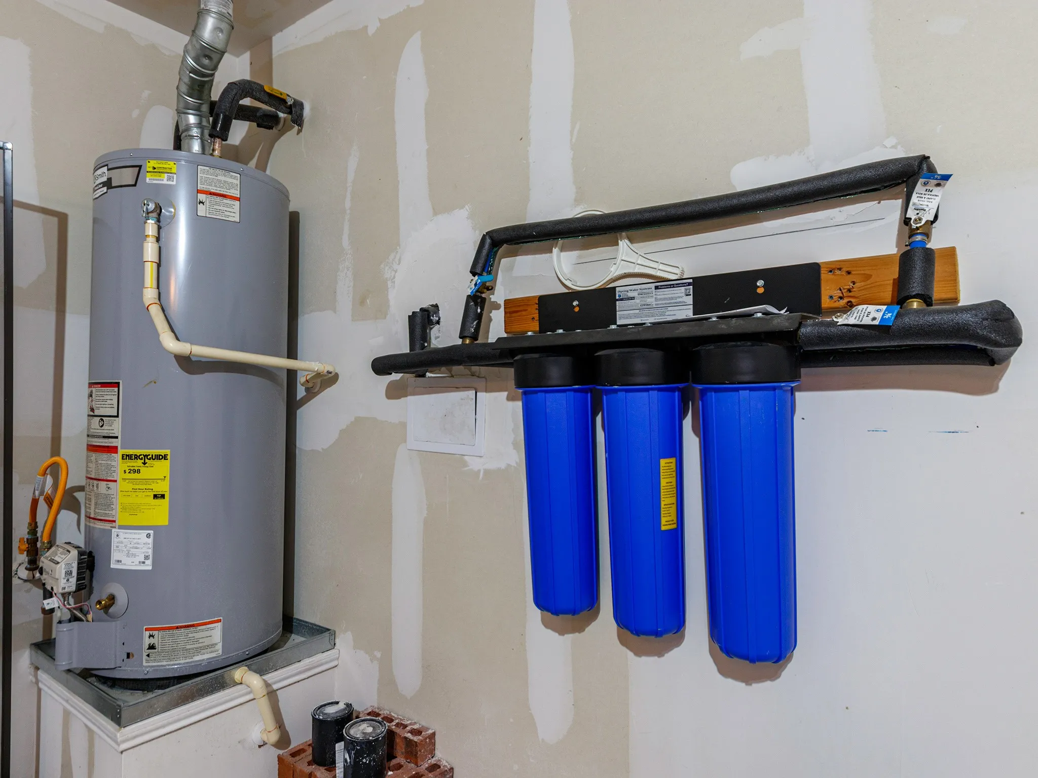 Whole house water filtration system located in garage.