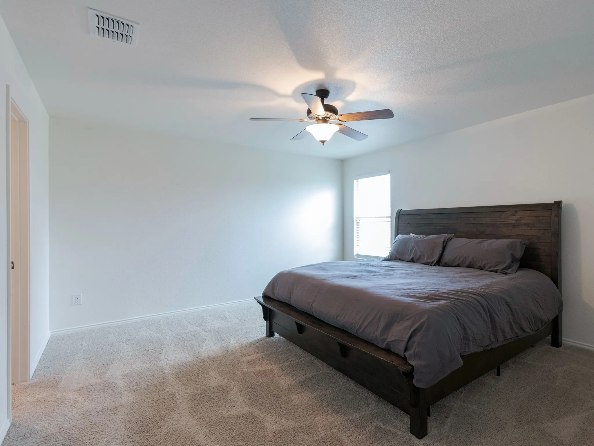 Primary bedroom located at back of house