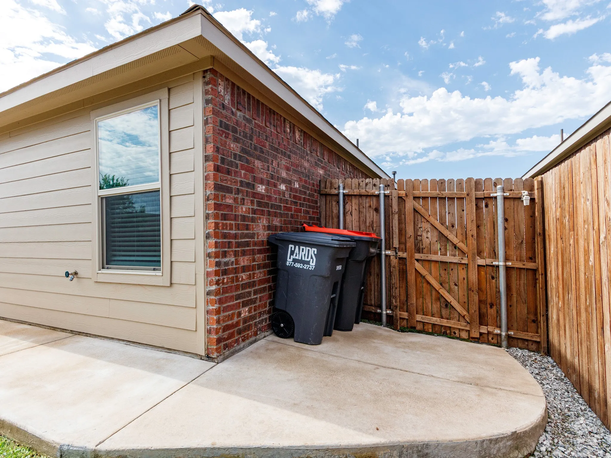 Extended sidewalk to dedicated side yard storage area.