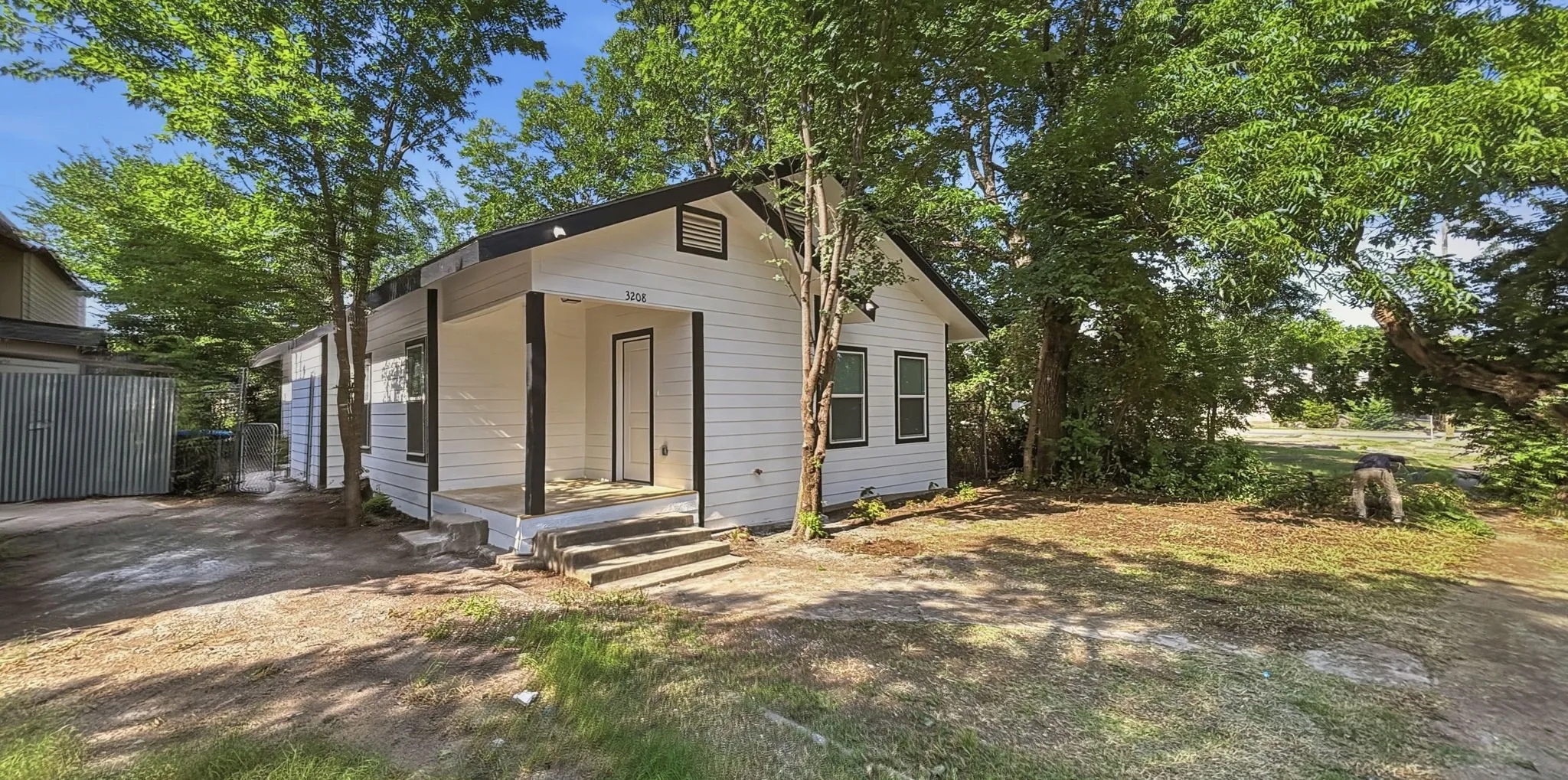 White exterior siding with dark trim accents