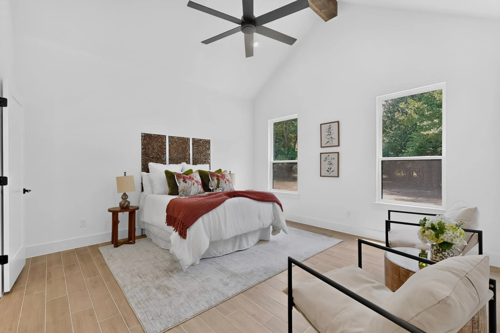 Vaulted ceiling featuring an exposed wood beam and a contemporary ceiling fan