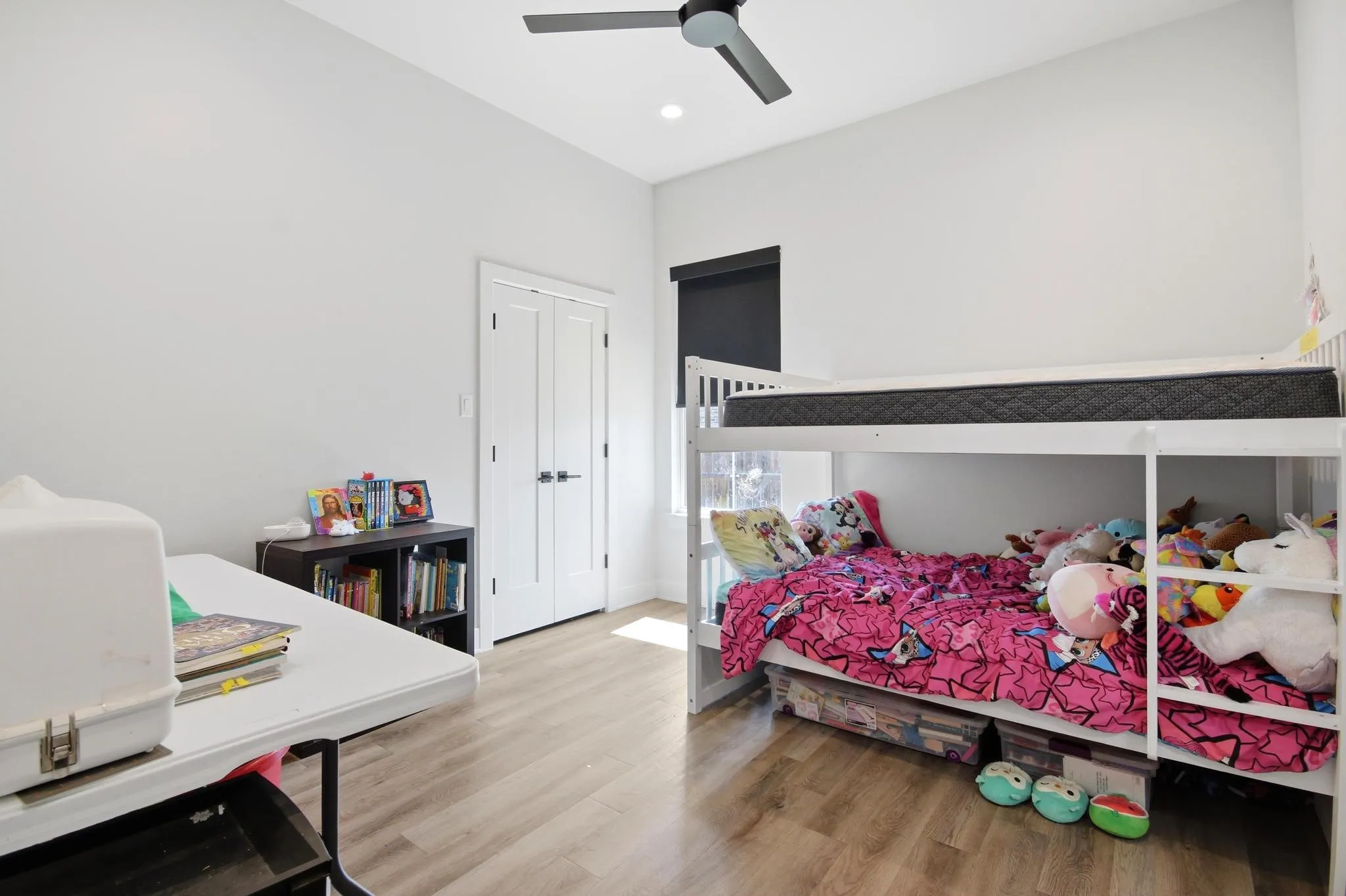 Room featuring wood-finish flooring, recessed lighting, and a modern ceiling fan