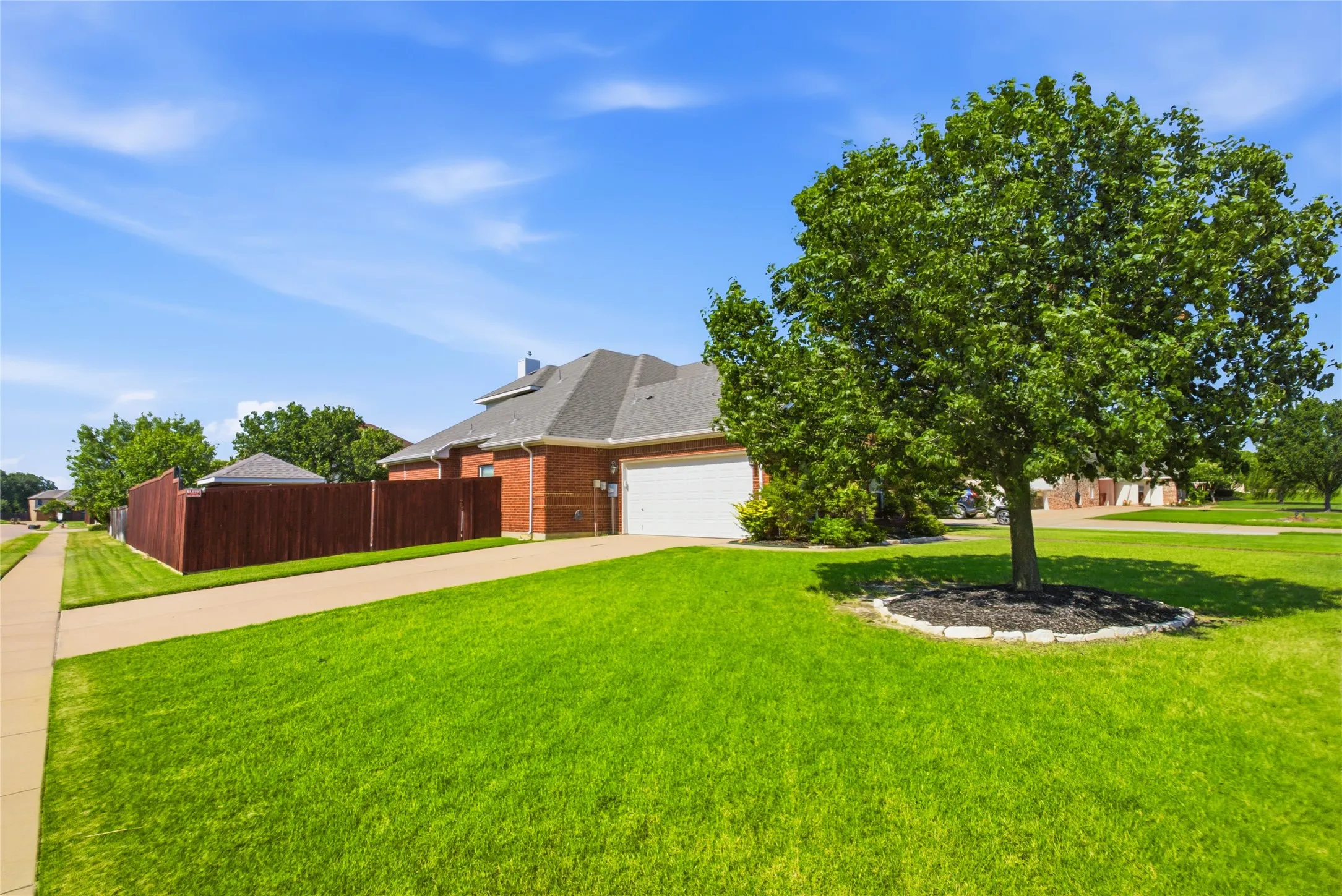 Side entry double garage, private entrance, corner lot
